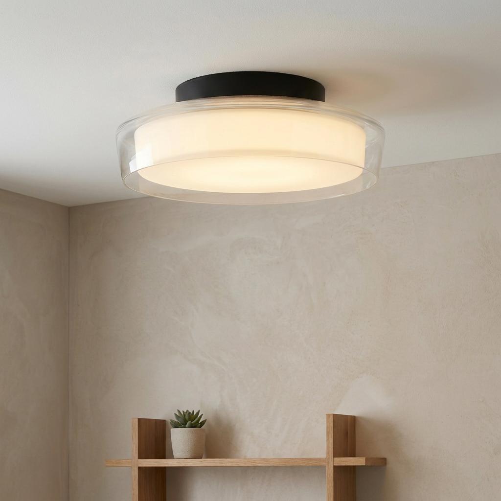 Modern black flush ceiling light with dual clear and opal glass shades illuminated in a neutral room.