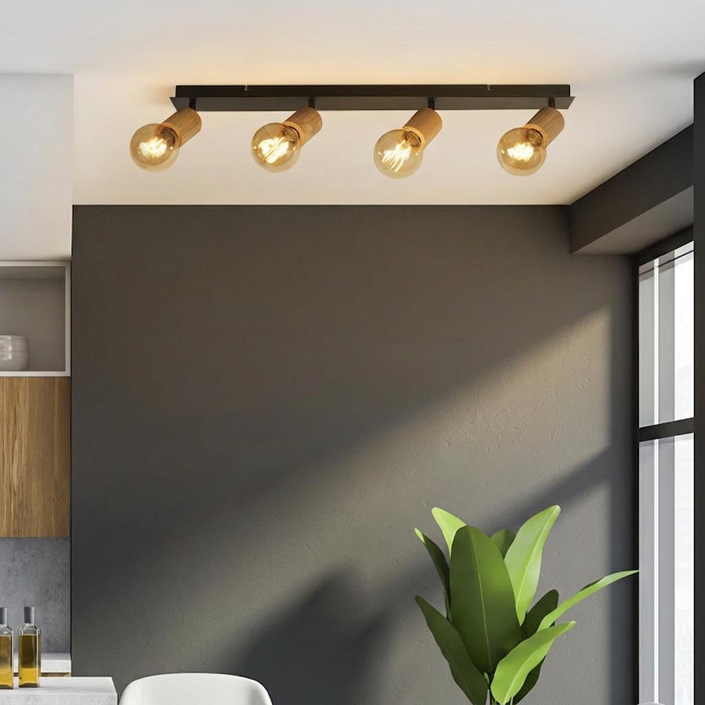 A 4-light bar spotlight fixture with wooden accents and warm bulbs mounted on a white ceiling.