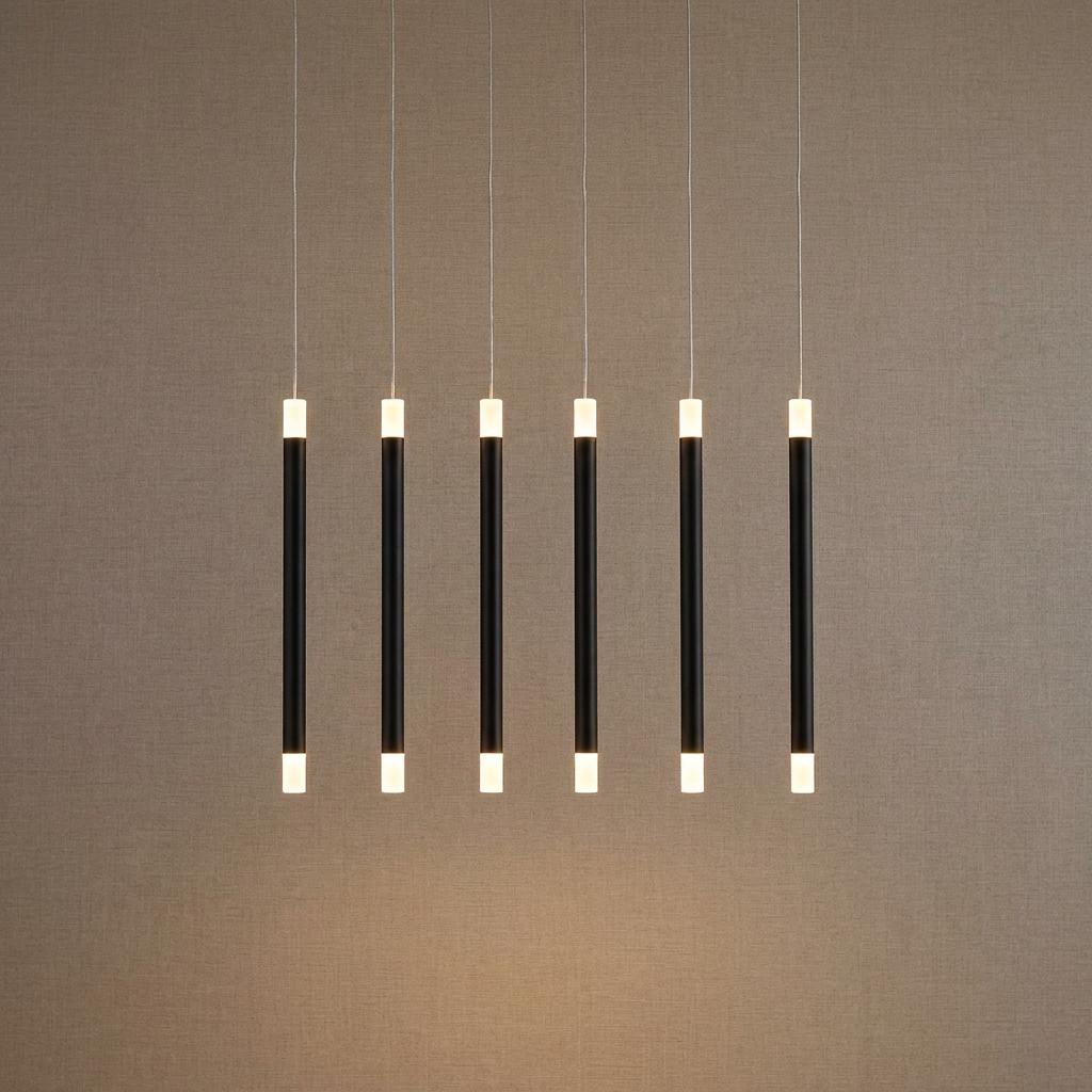 Six slim black bar pendant lights with illuminated white tips suspended in a row against a tan textured wall.