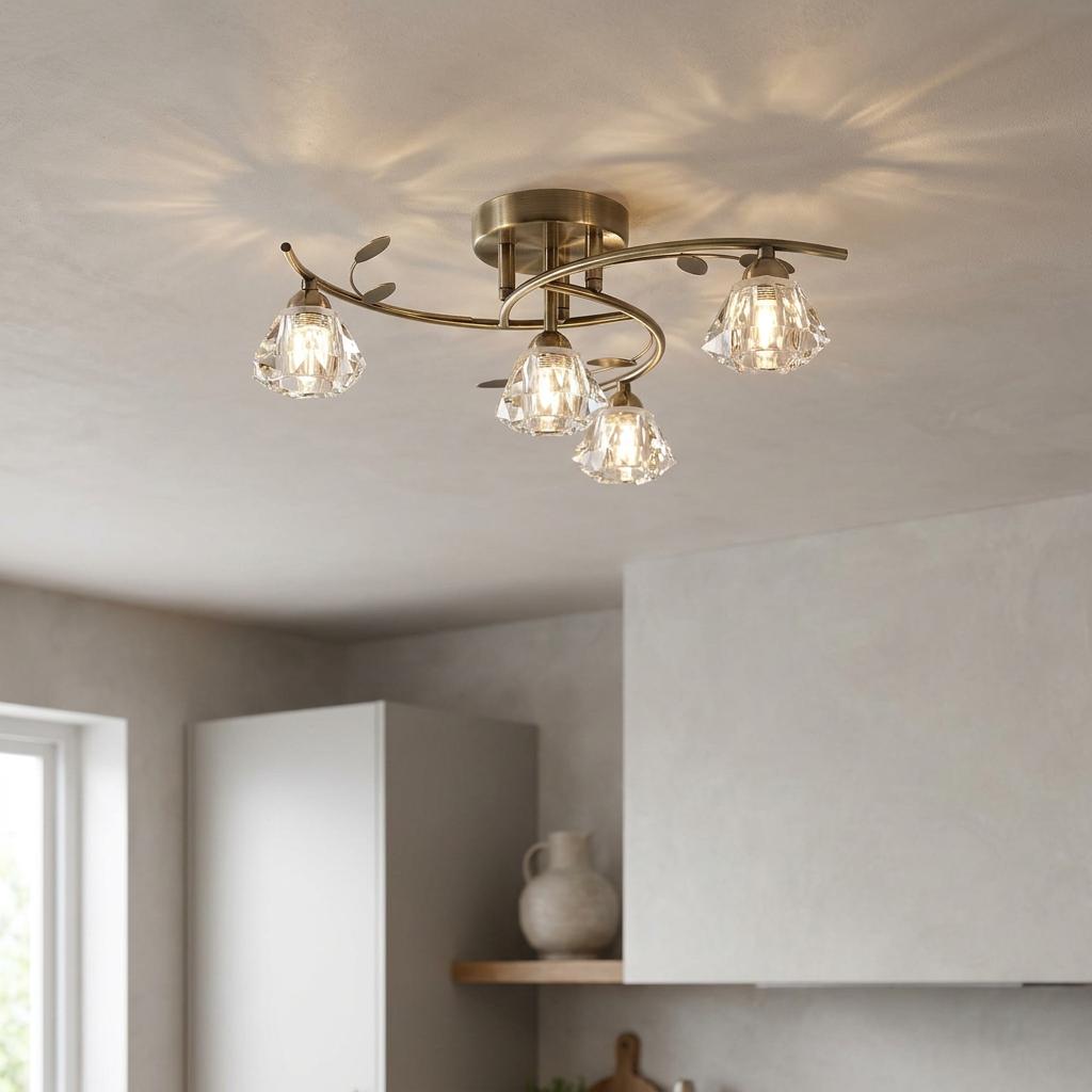 Four-light brass semi-flush ceiling light with faceted crystal shades and leaf details on a white ceiling.