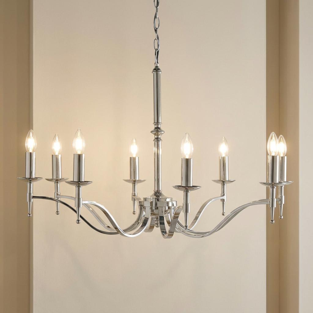 Stanford 8 light polished nickel chandelier with elegant curved arms and candle bulbs against a cream background.