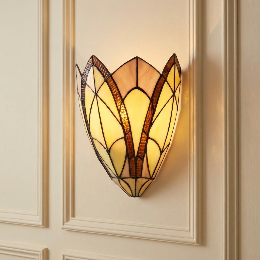 Lit Tiffany-style stained glass wall light with amber swirl patterns mounted on a cream paneled wall.
