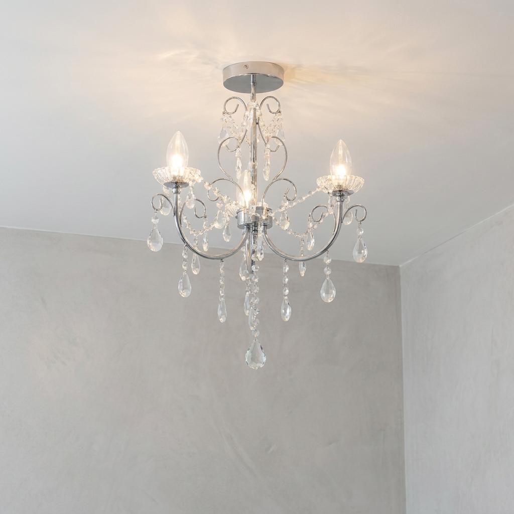 Tabitha three-light chrome bathroom chandelier with crystal droplets against a grey wall.