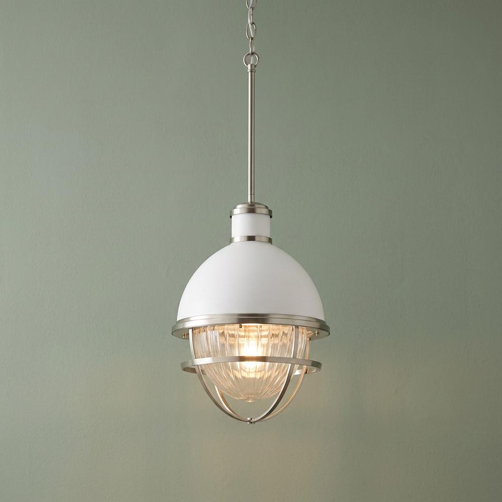 Tollis 1 light nickel and white pendant light with a ribbed glass shade against a sage green background.