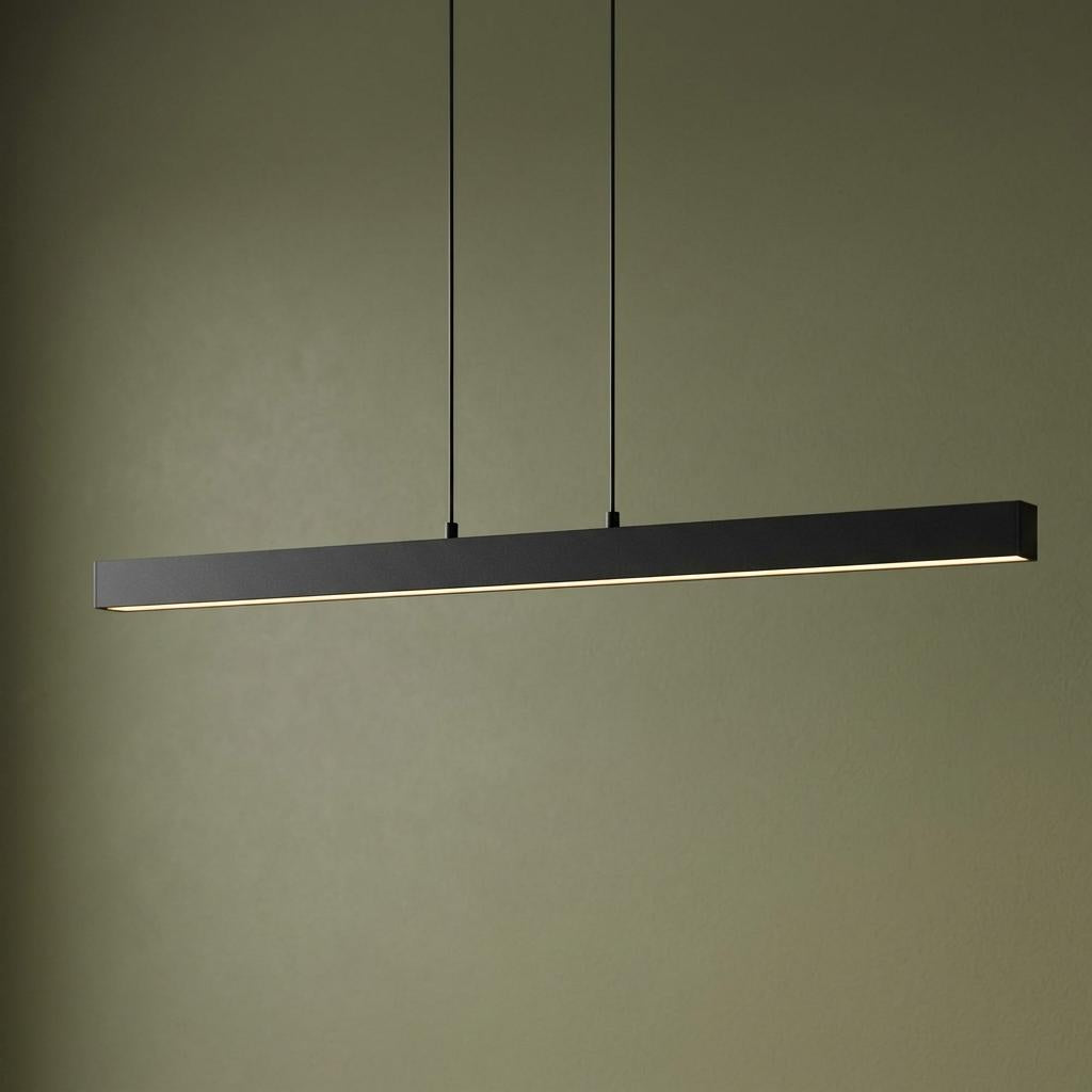 Minimalist black linear LED pendant light suspended against a muted olive green wall.