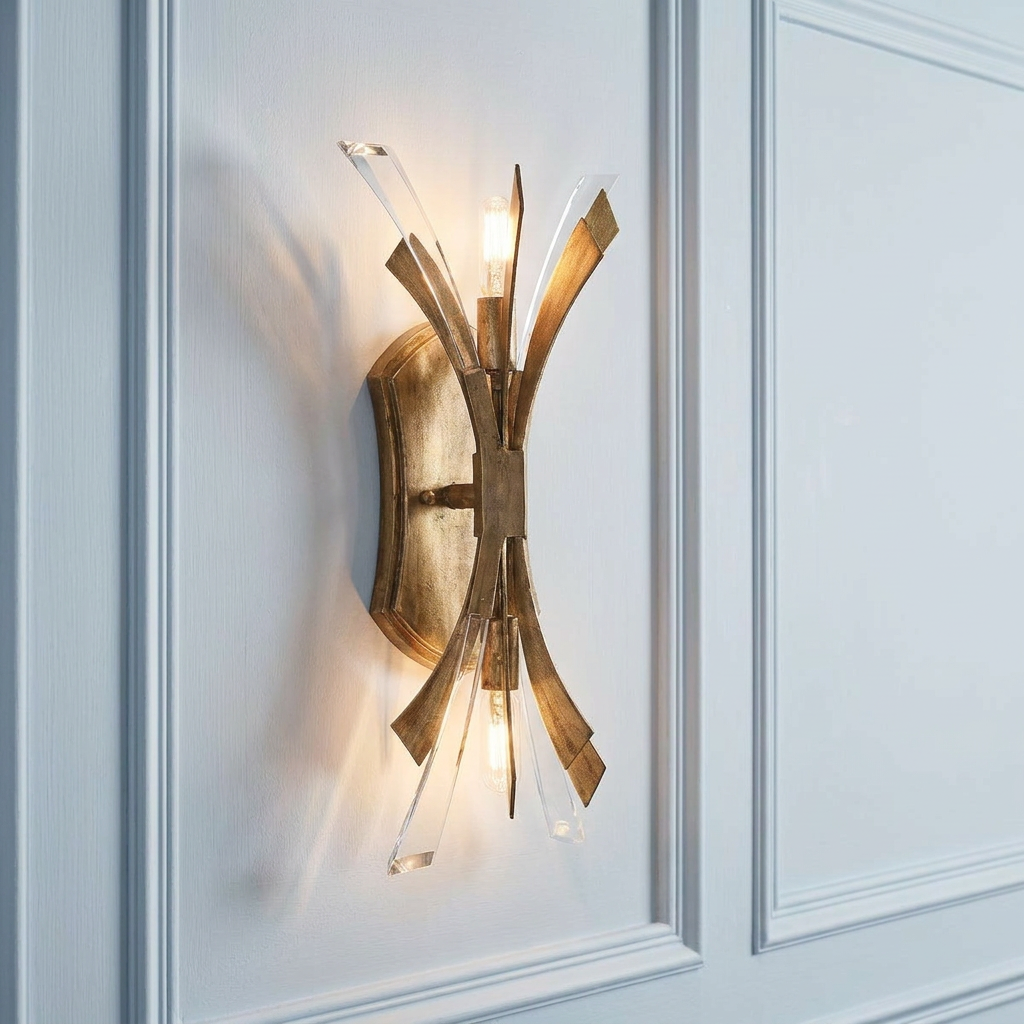 Vida 2 light gold wall sconce with crystal accents and an architectural design on a paneled wall.