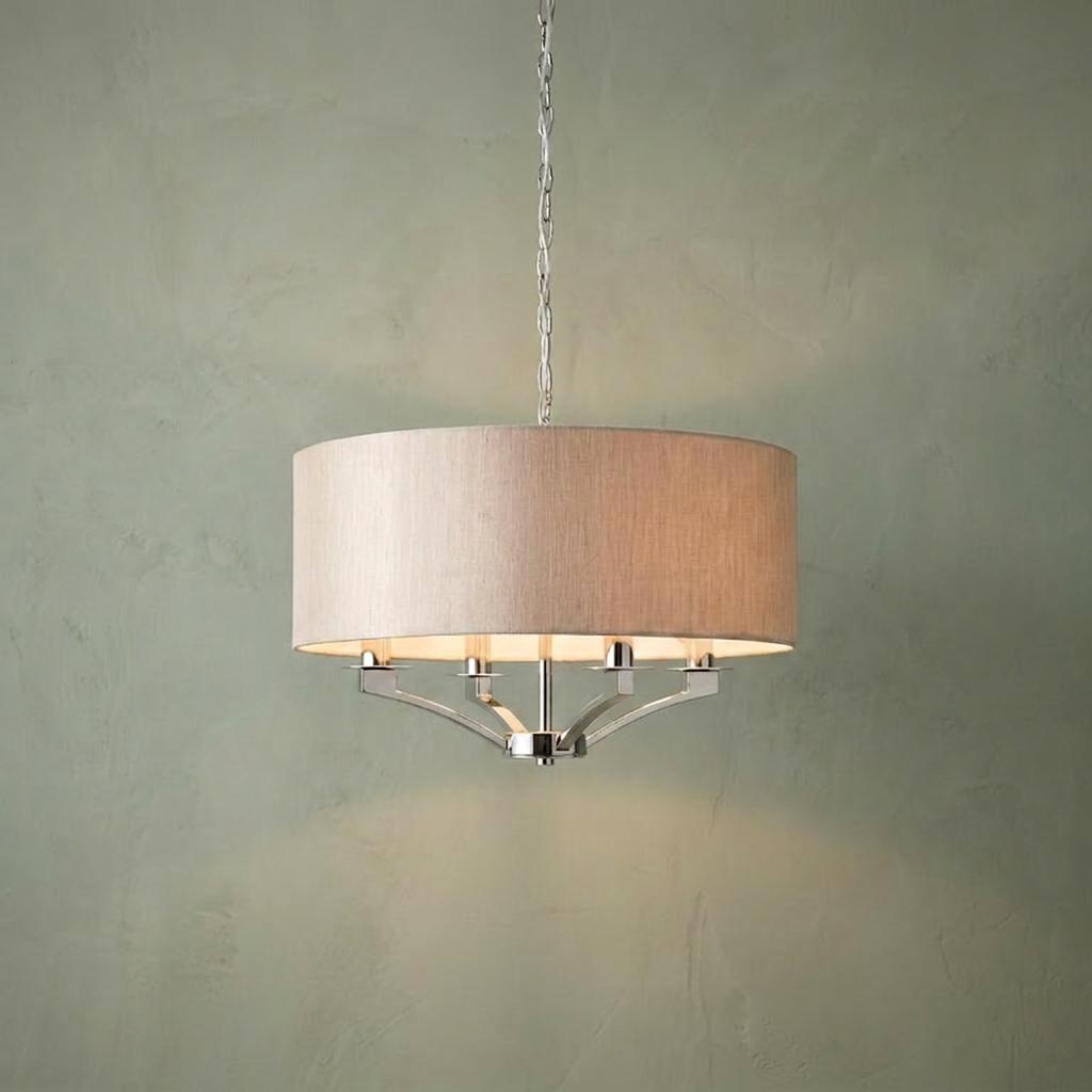 Vienna 4-light ceiling pendant with a polished nickel frame and neutral linen drum shade against a green wall.
