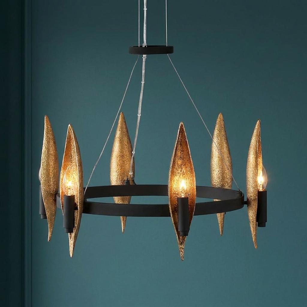Willow 6 light chandelier with a black hoop and textured gold leaf shades set against a dark teal wall.