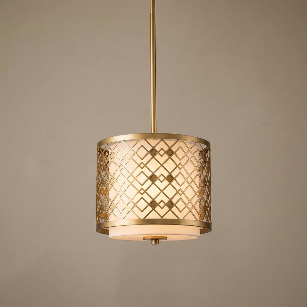 Small gold pendant light with a geometric lattice cage over an illuminated white diffuser shade.
