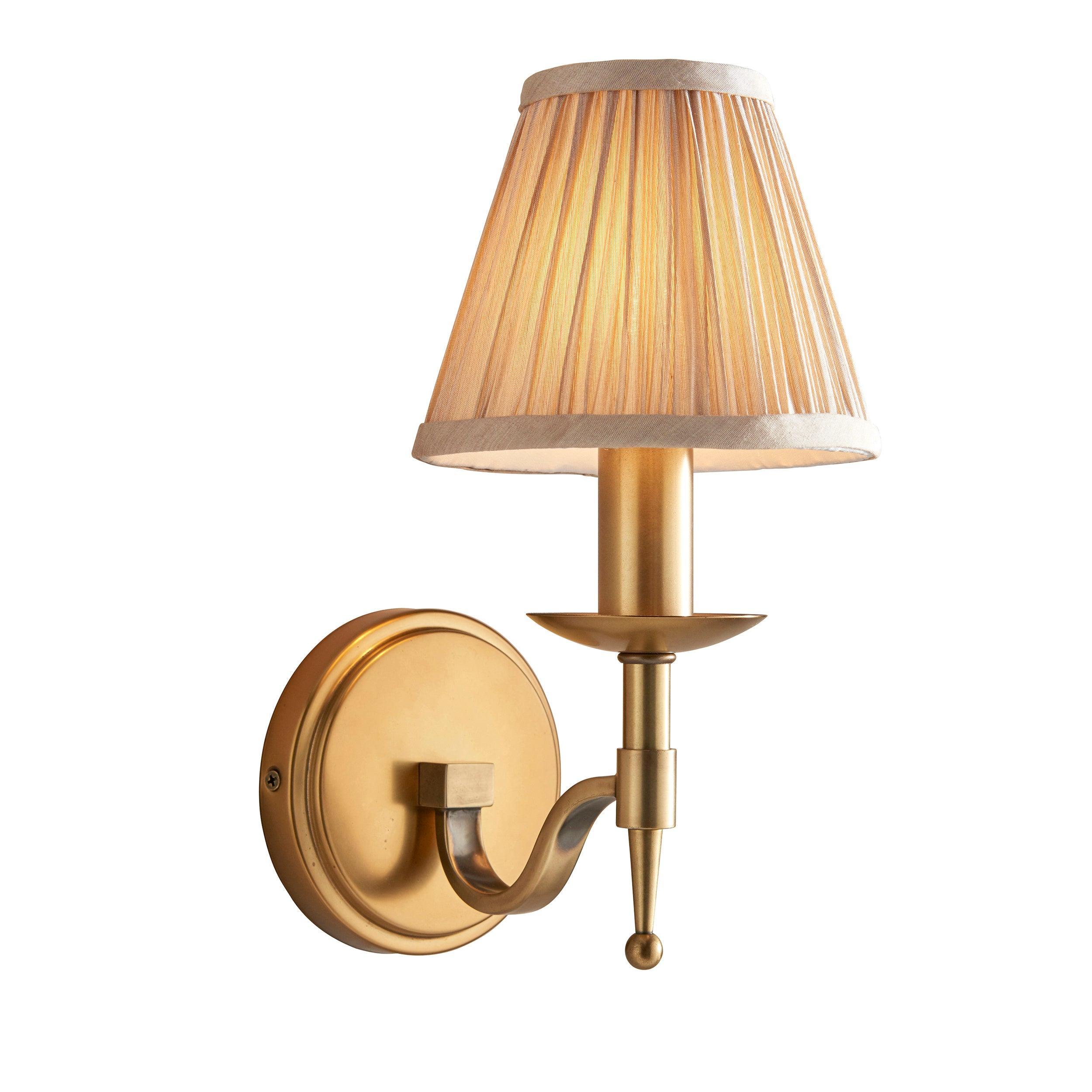 stanford brass single wall light with beige shade Living room lighting image