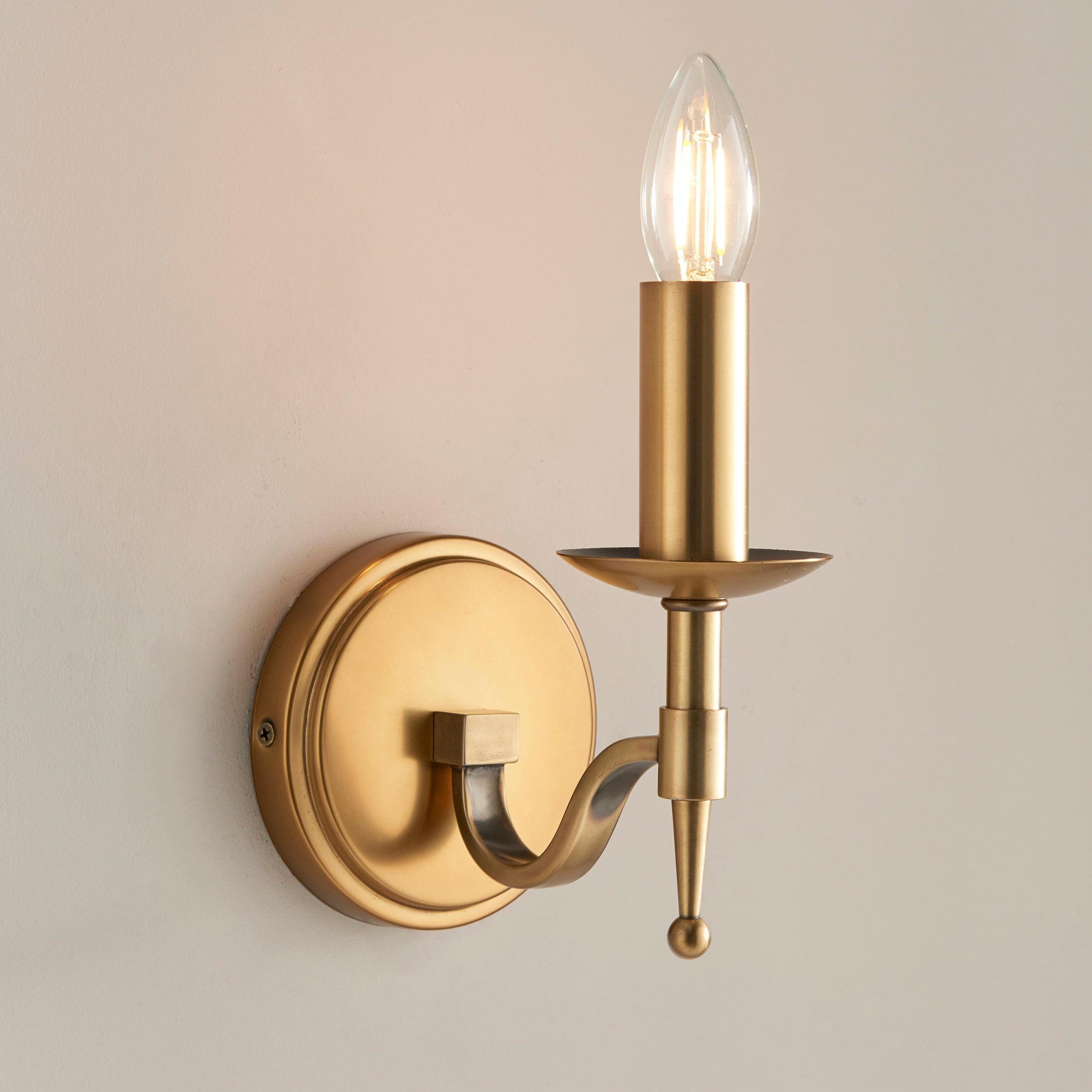 stanford brass single wall light with beige shade Hallway Lighting Close Up