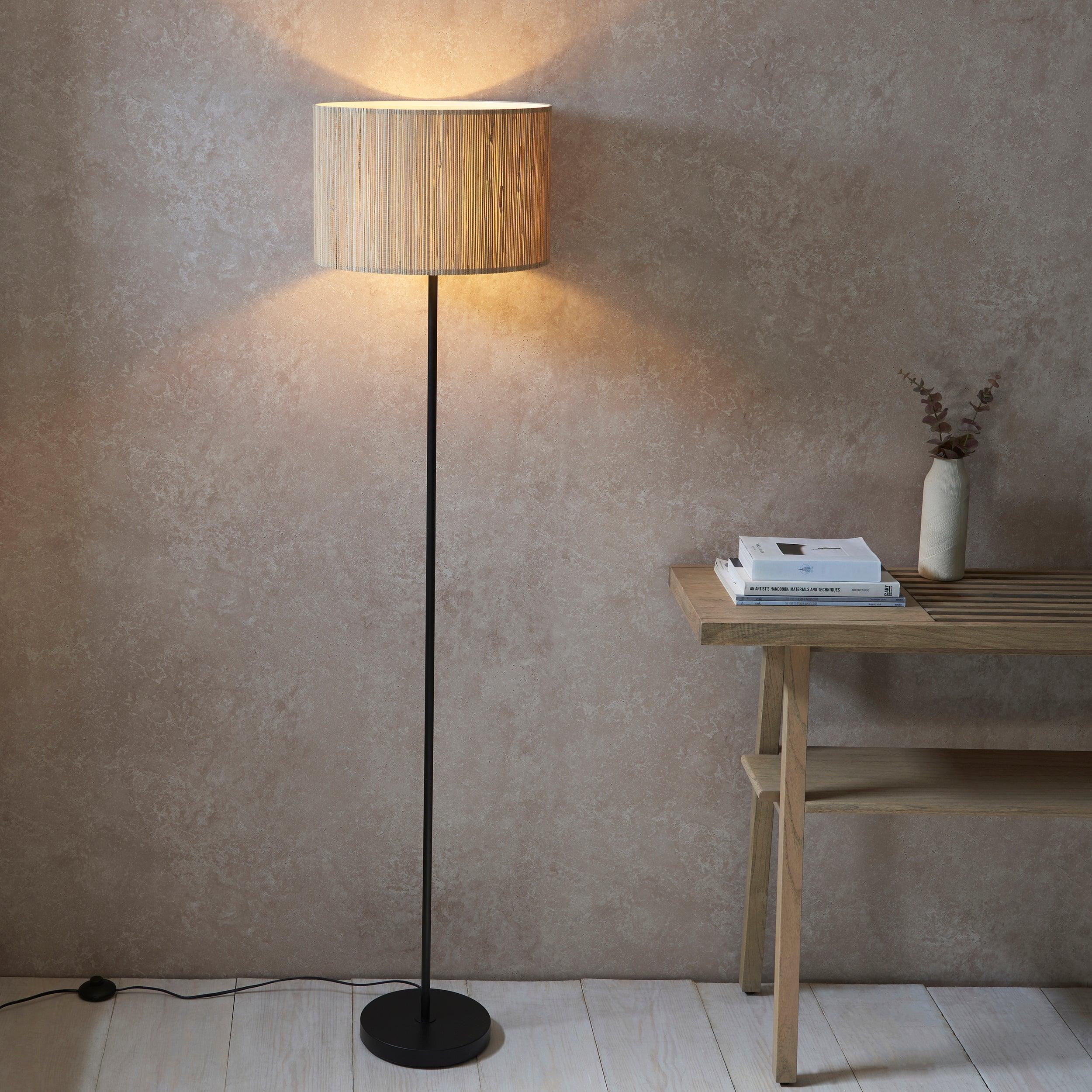 longshore black floor lamp with seagrass shade by Endon Lighting Living Room Family Shot