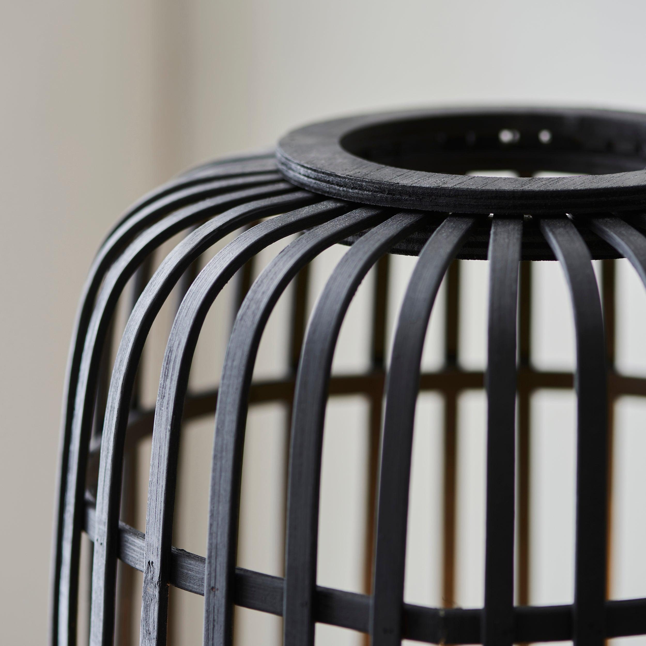 mathias black floor lamp with bamboo shade by Endon Lighting Bedroom Hero Shot