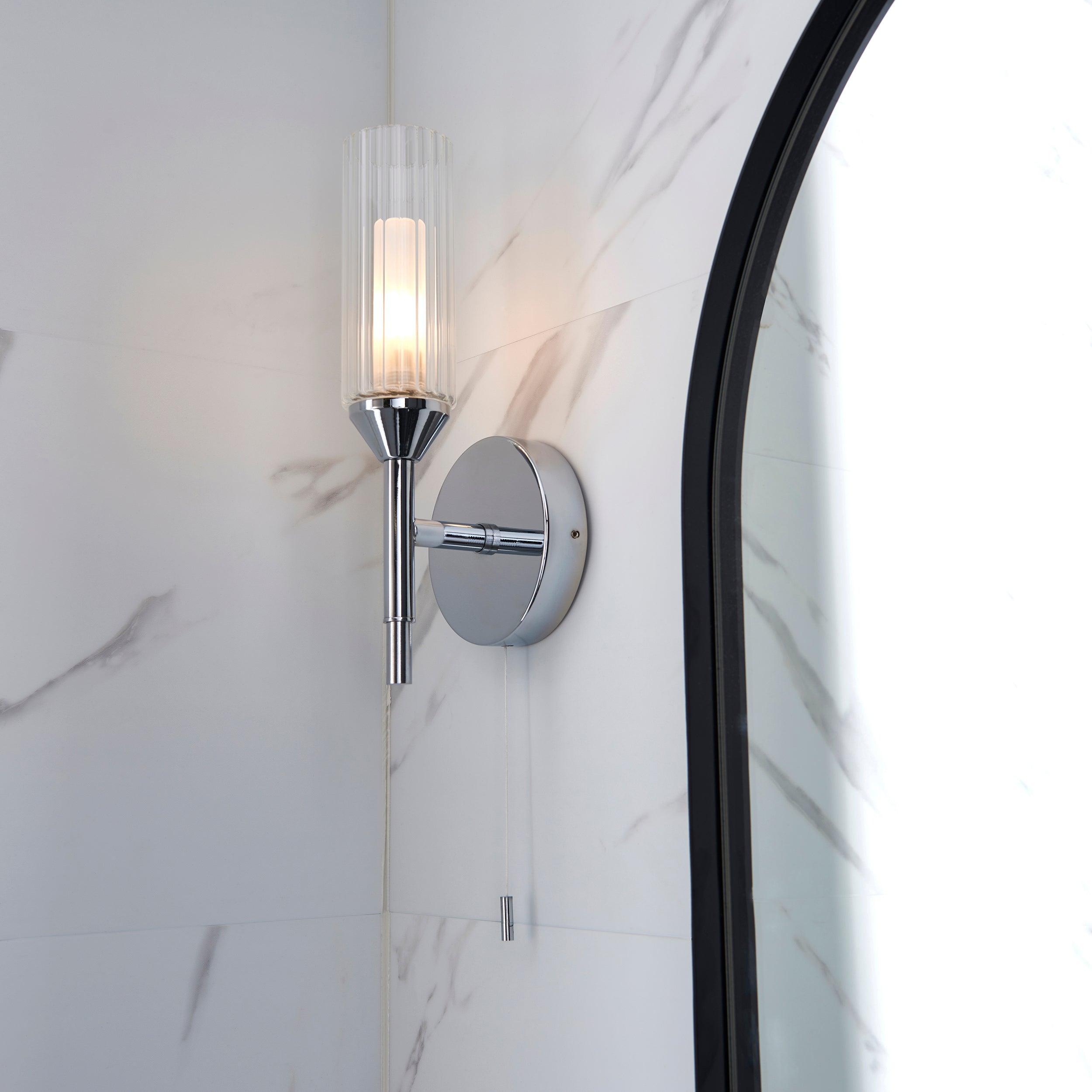 oundle single chrome bathroom wall light pull cord Close Up Lit Image