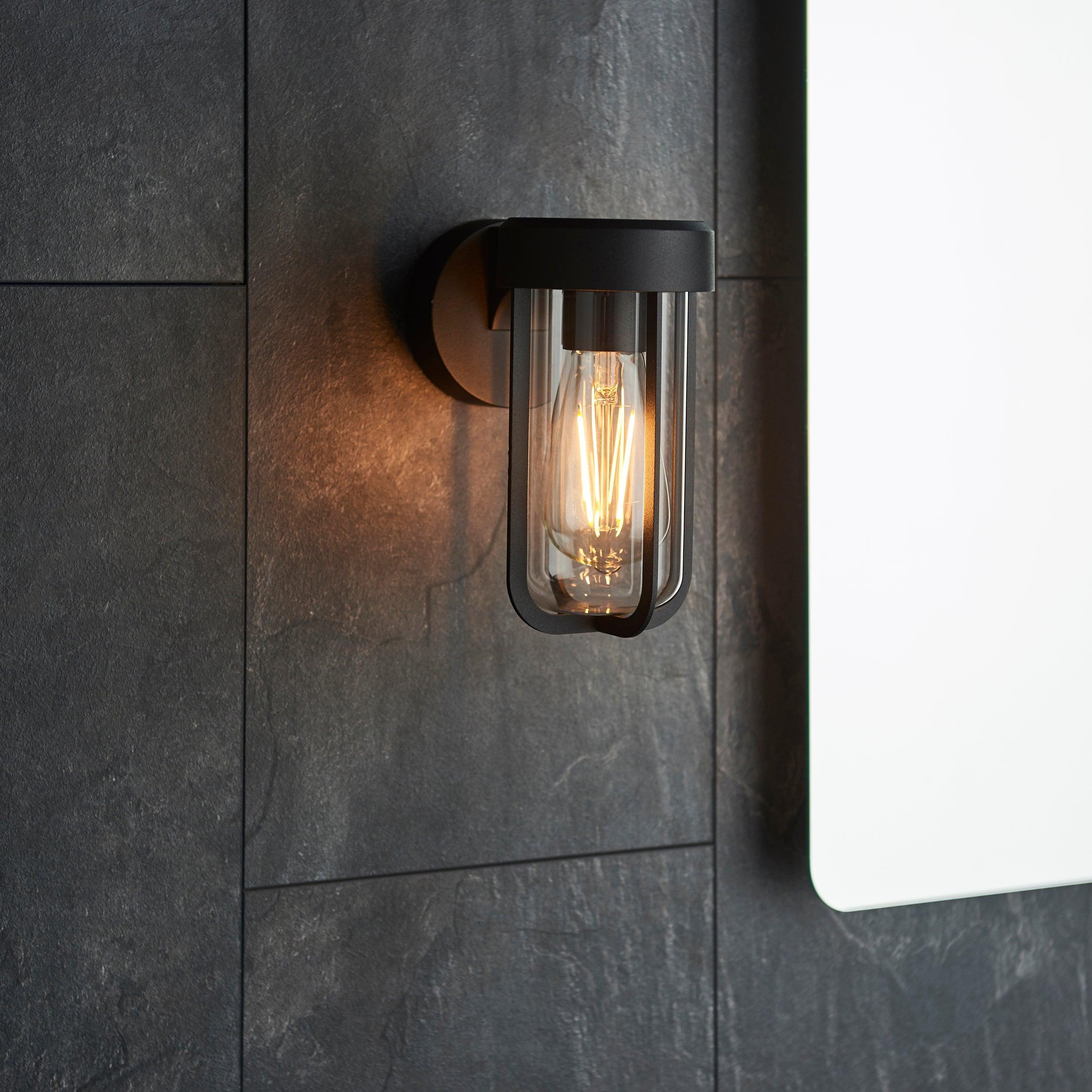 newquay black outdoor wall light with clear glass shade close fitting image
