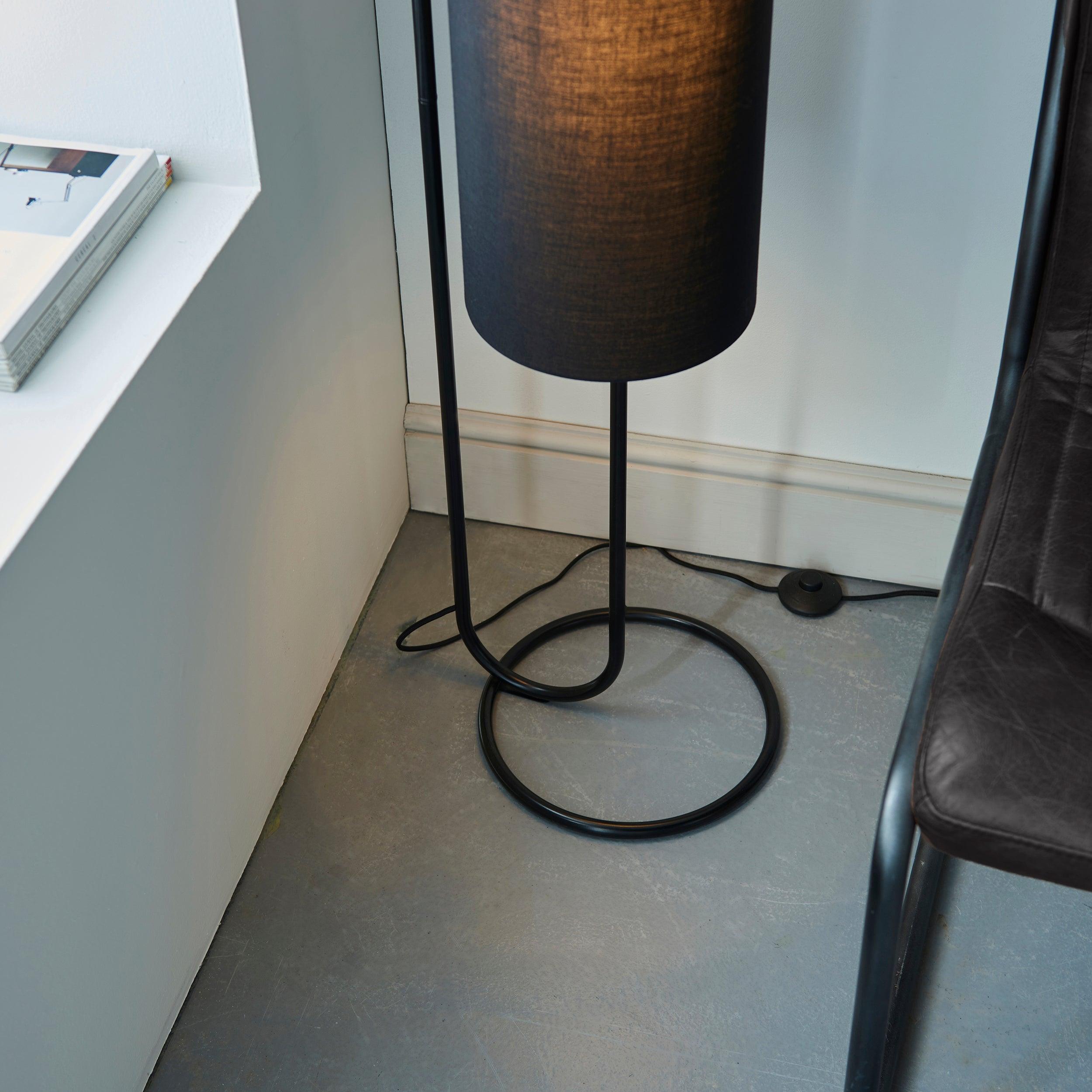 kilburn black modern floor lamp with black shade Close Up Lit Image