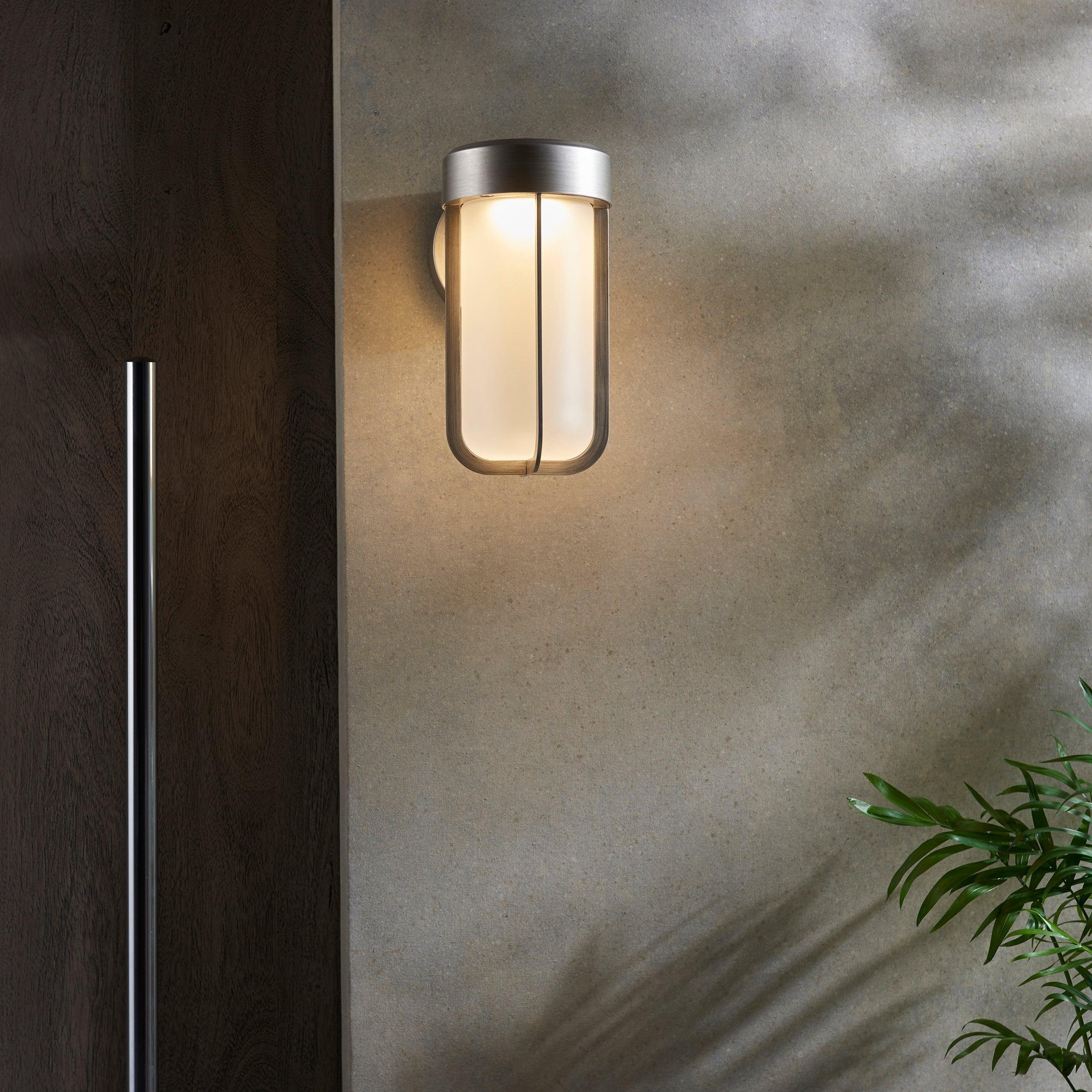 newquay led silver outdoor wall light with frosted shade Close Up Lit Image