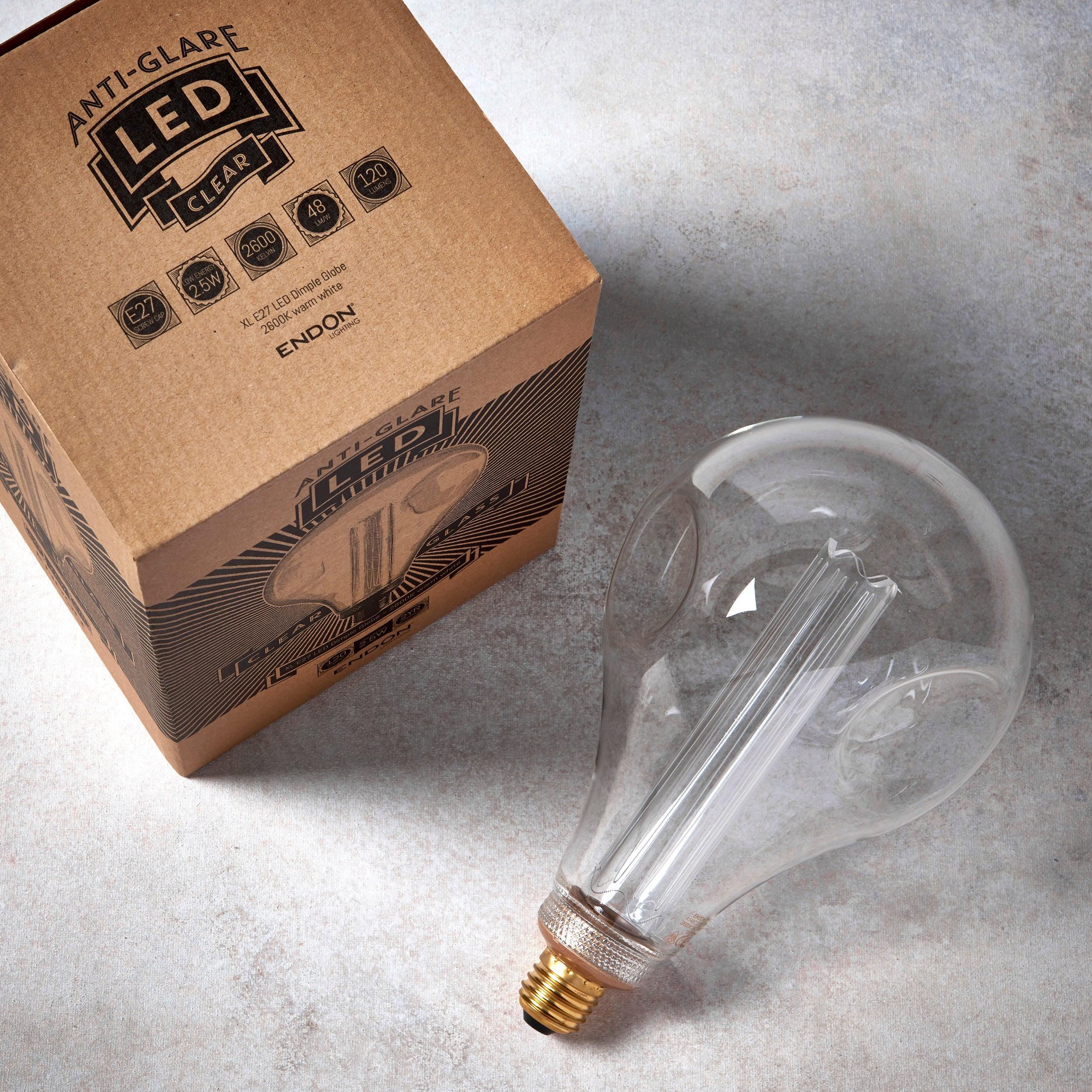 dimple e27 clear globe 2 5w fillament led light bulb 148mm Close Up Lit Image