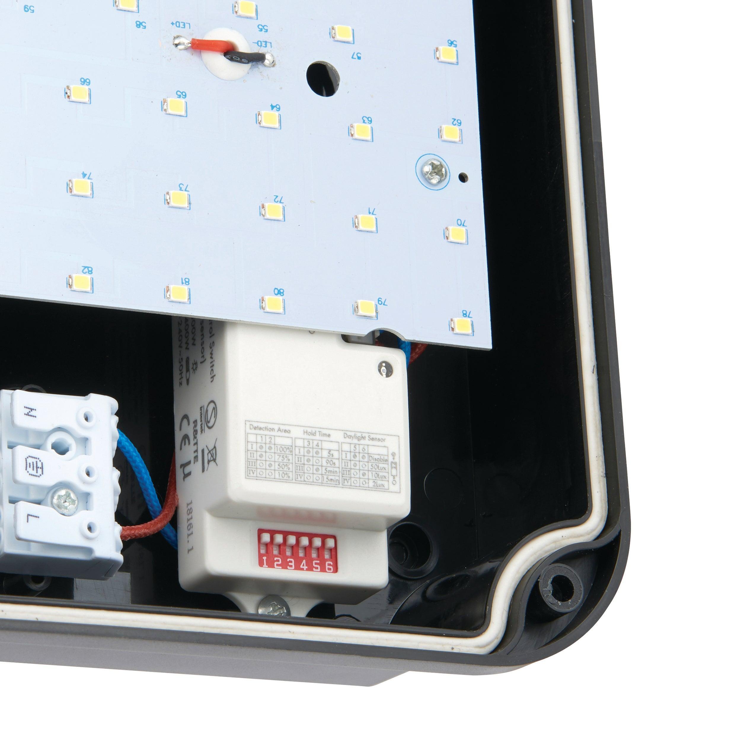 lucca small black outdoor wall light with microwave sensor ip65 by saxby lighting, close up image 136