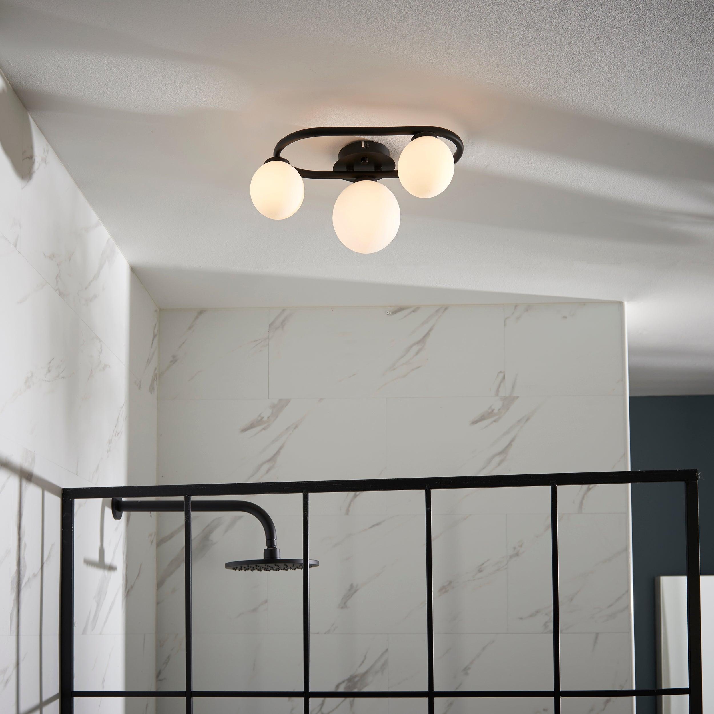 pulsa 3 light black glass semi flush ceiling light by Endon Lighting Living room close up image