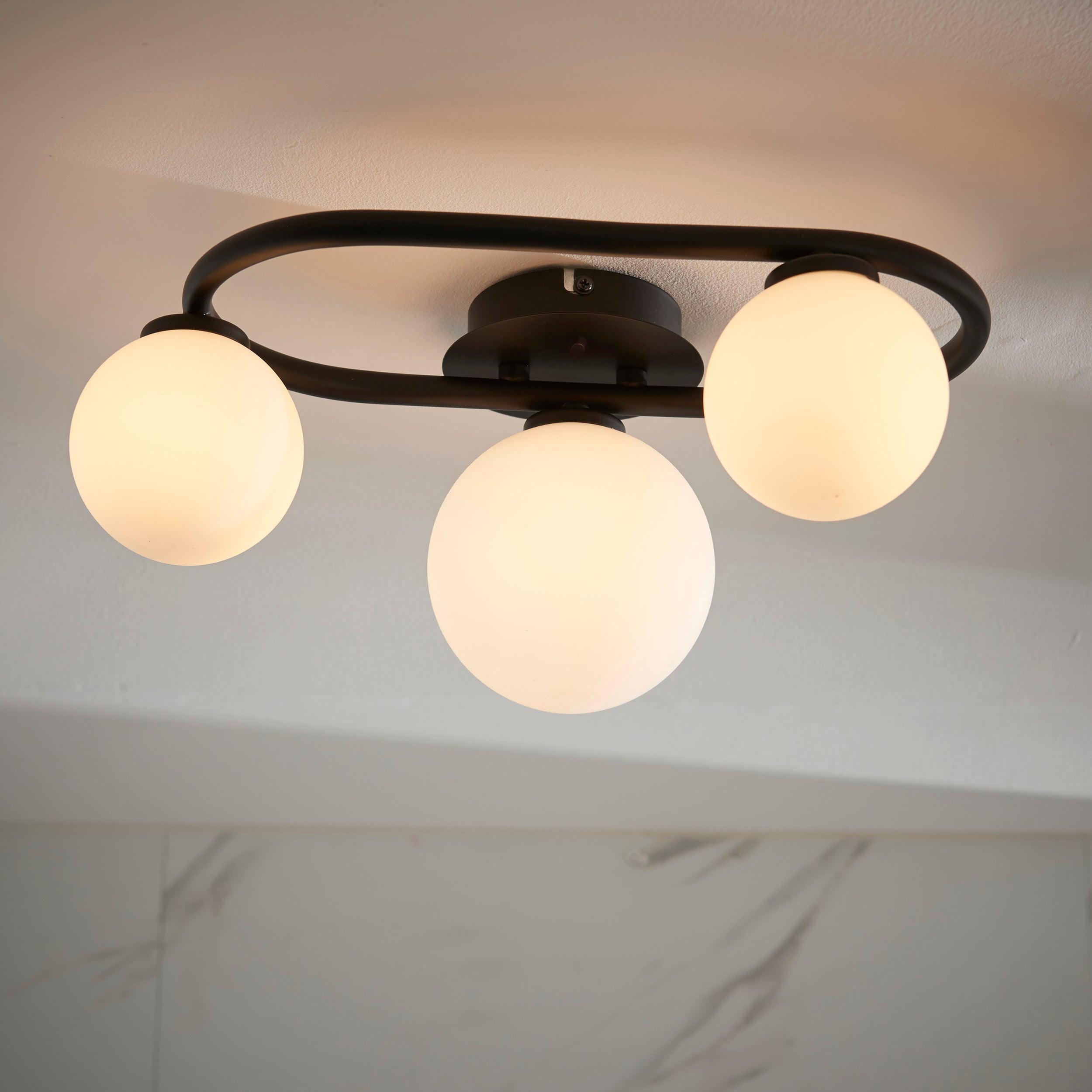 pulsa 3 light black glass semi flush ceiling light by Endon Lighting Living Room Family Shot