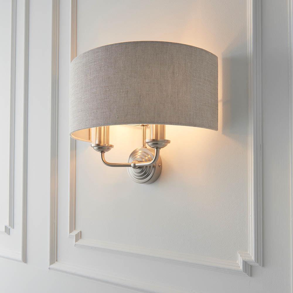 highclere brushed chrome wall light natural linen shade by Endon Lighting Bedroom Close Up Image