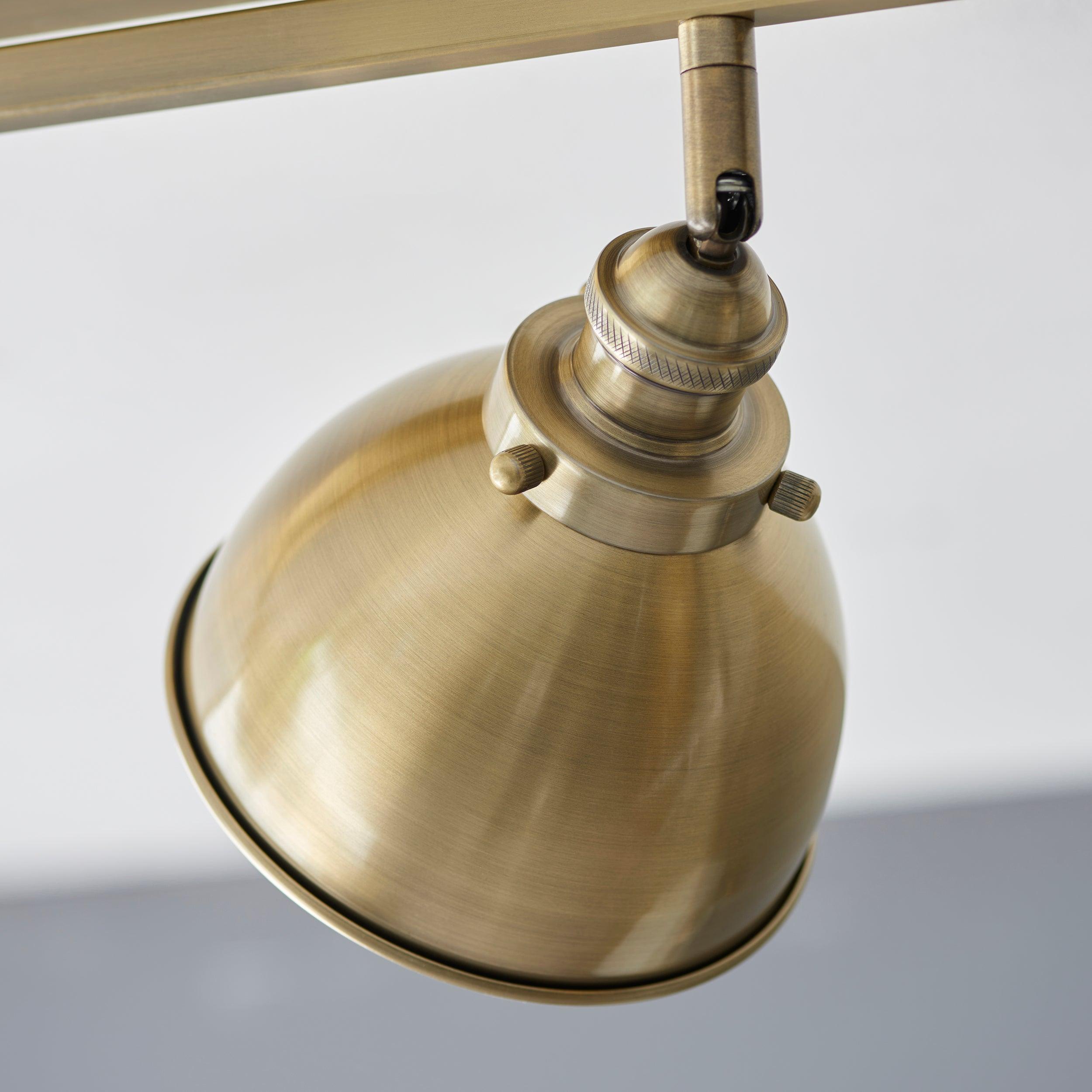 wyatt 3 light brass industrial spot light by Endon Lighting Bedroom Close Up Image