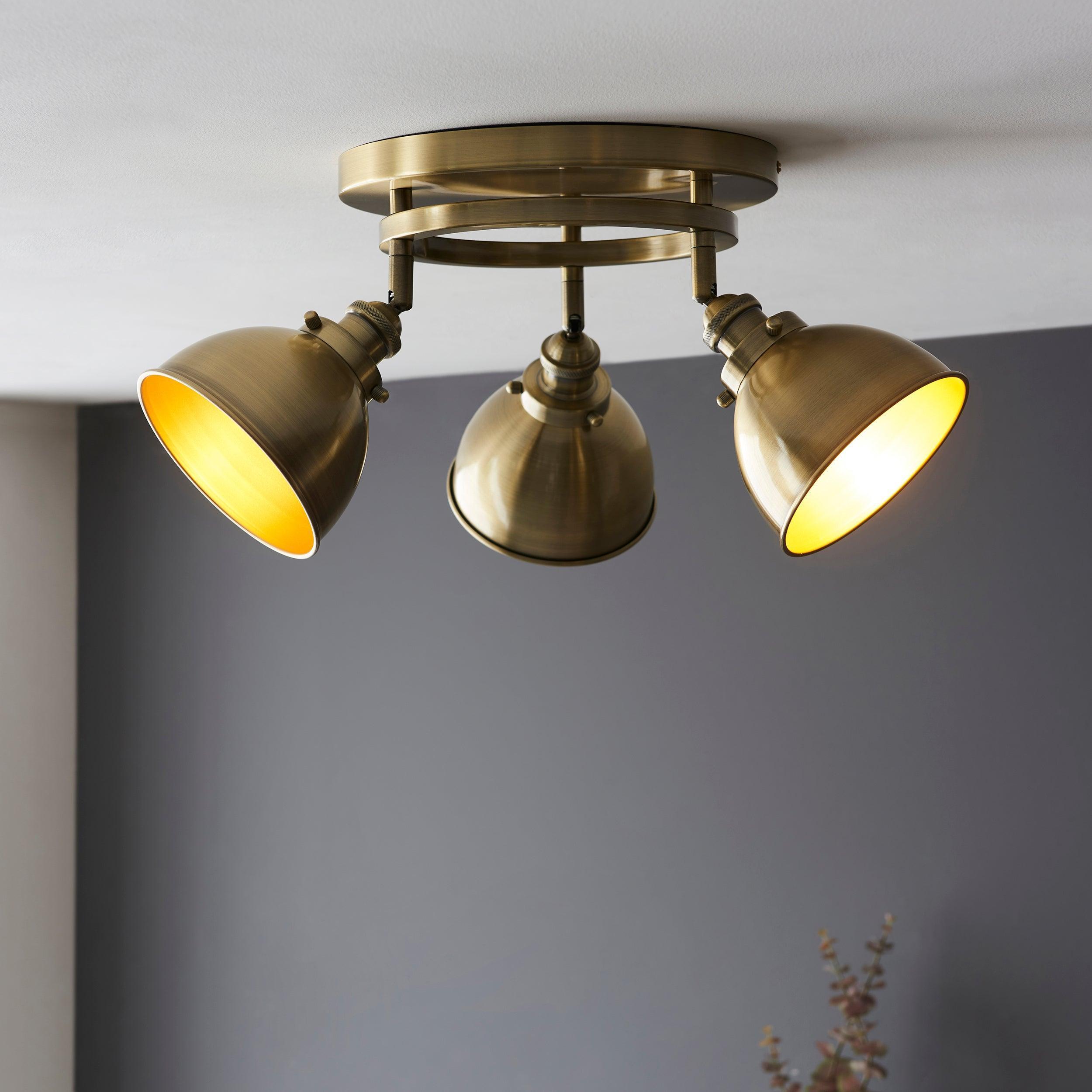wyatt 3 light brass industrial style spot light by Endon Lighting Bedroom Hero Shot