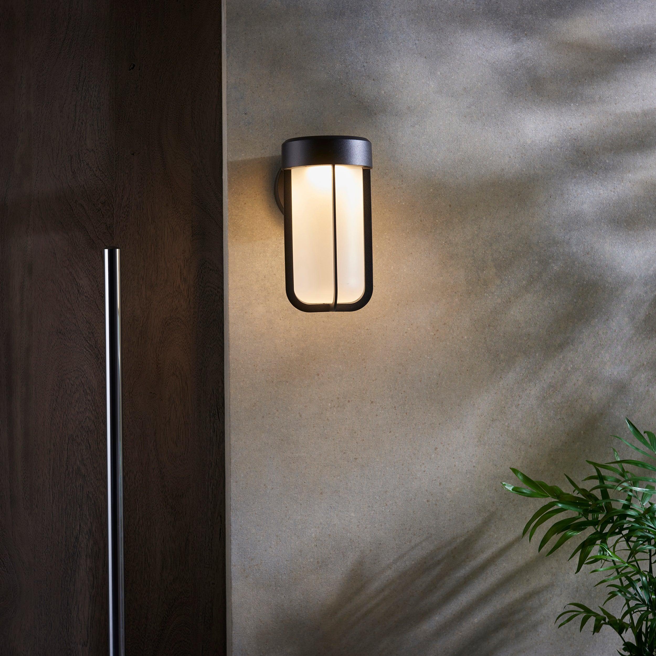 newquay black led outdoor wall light with frosted shade