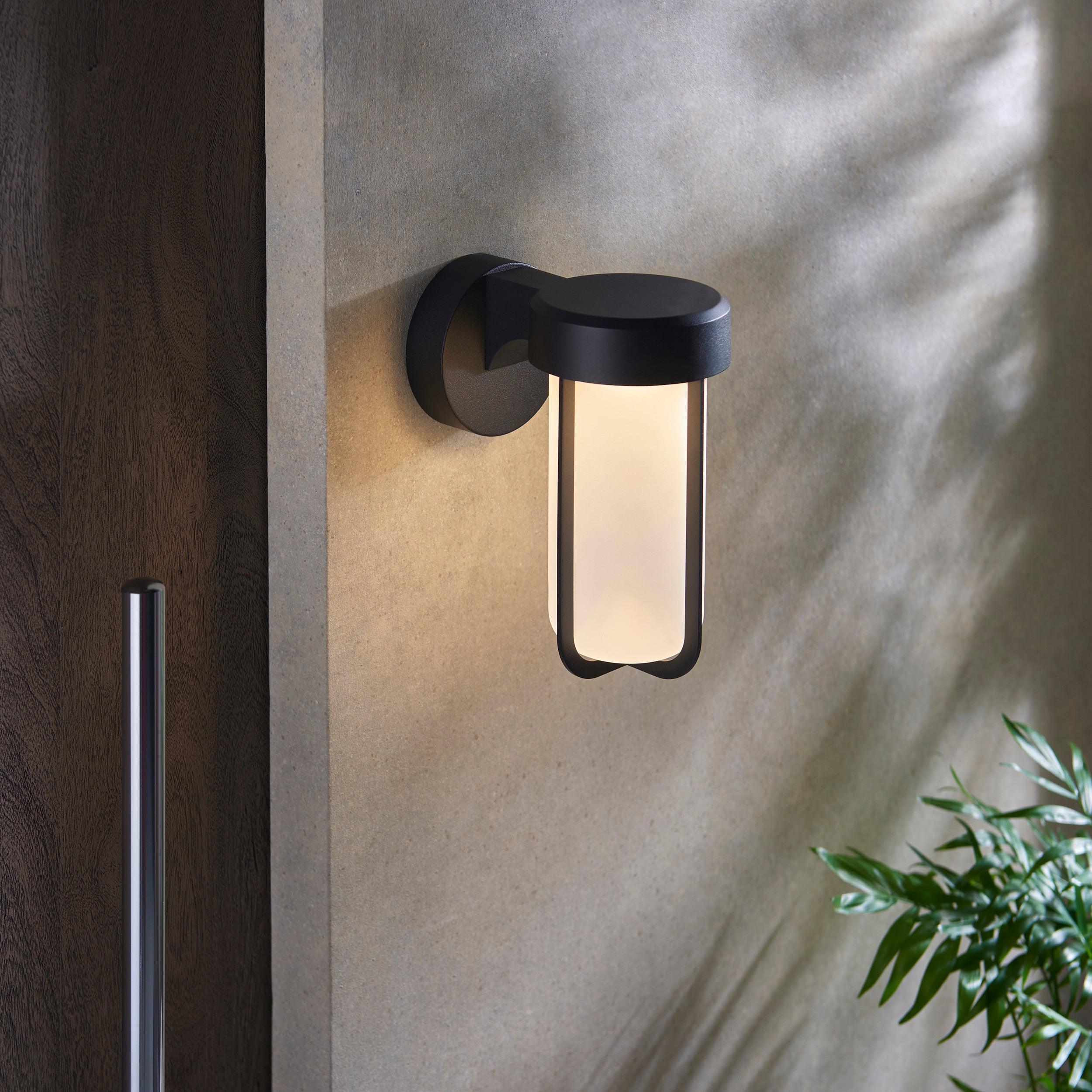 newquay black led outdoor wall light with frosted shade Close Up Lit Image