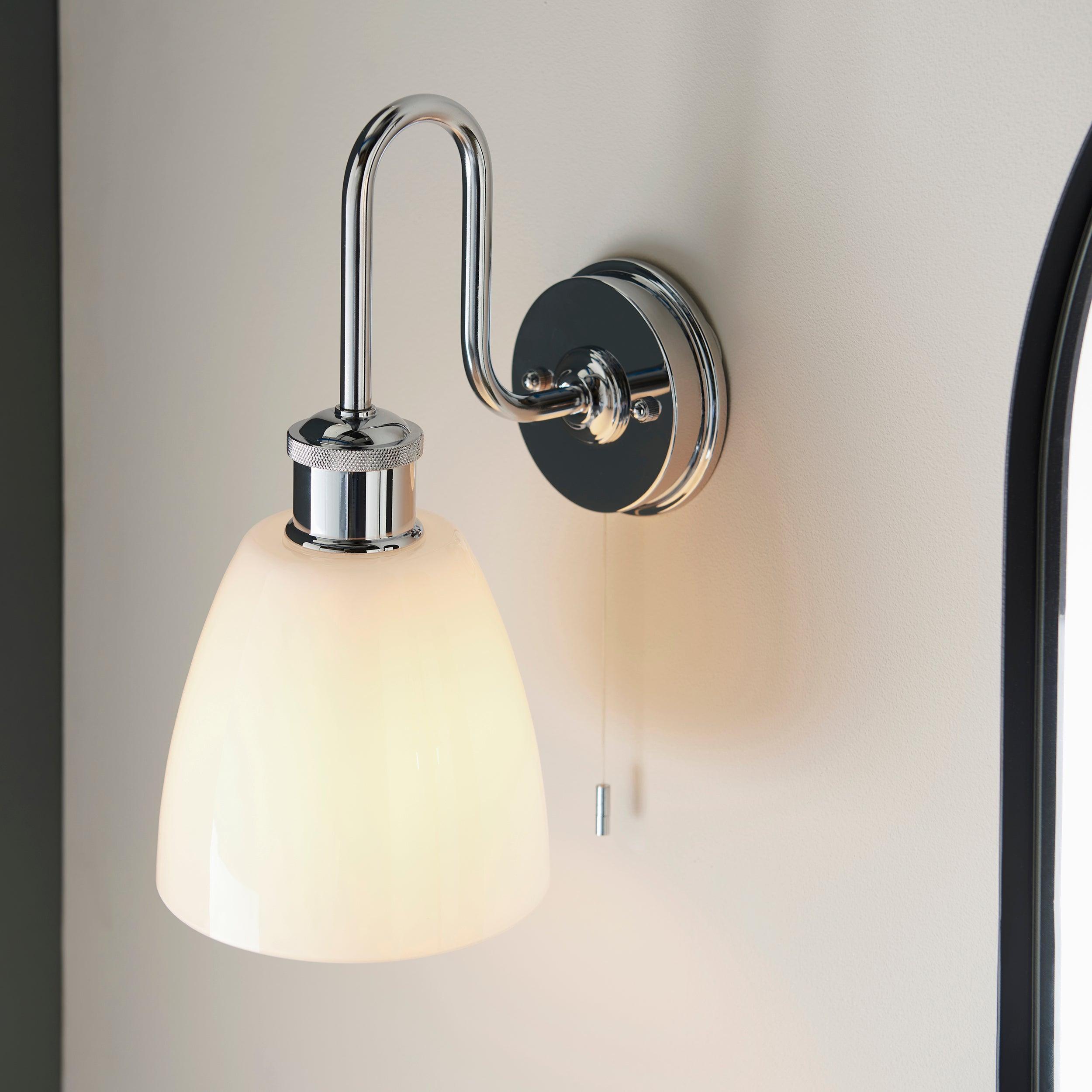 piper chrome bathroom wall light with opal glass shade by Endon Lighting Bedroom Close Up Image