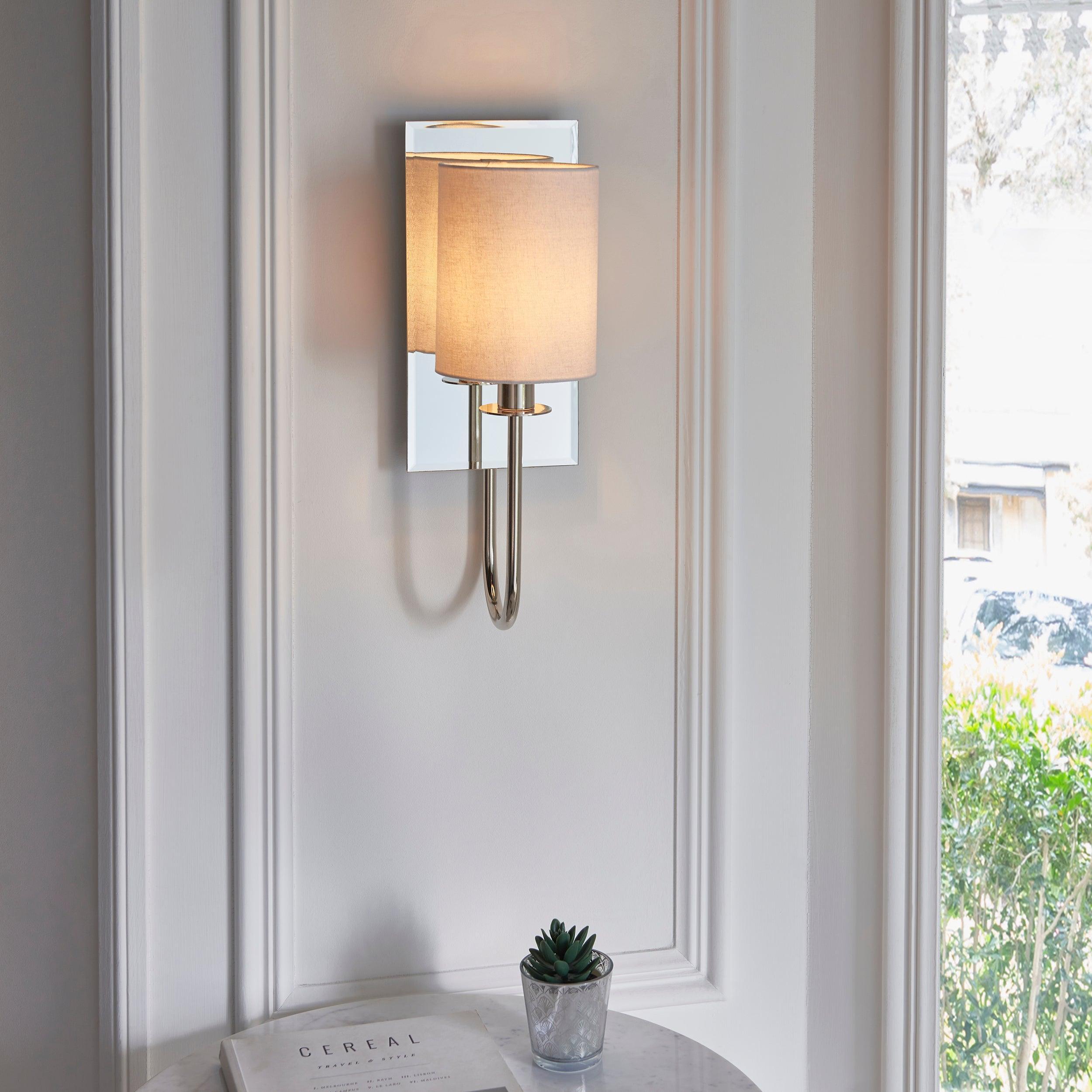 sheena nickel wall light with mirrored glass back mDining room lighting