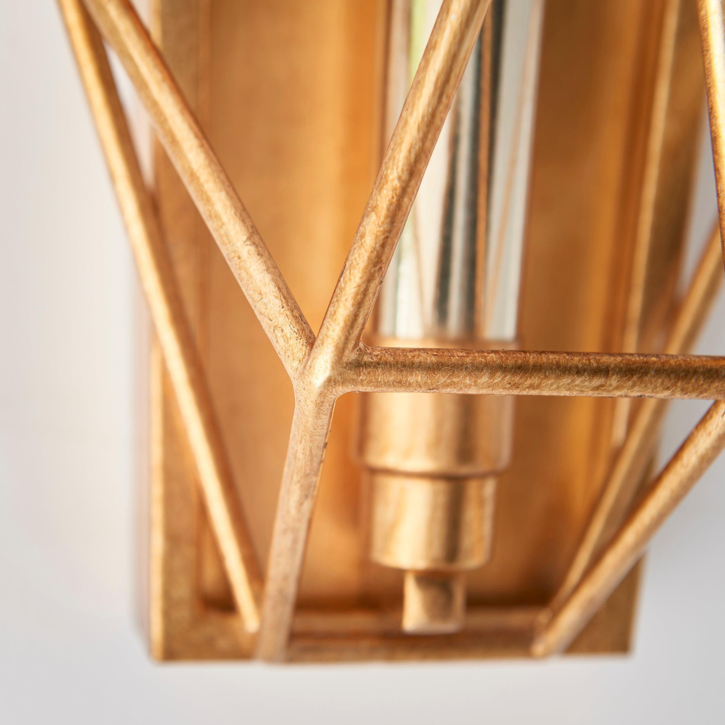 geometric gold leaf angular wall light Close Up Lit Image