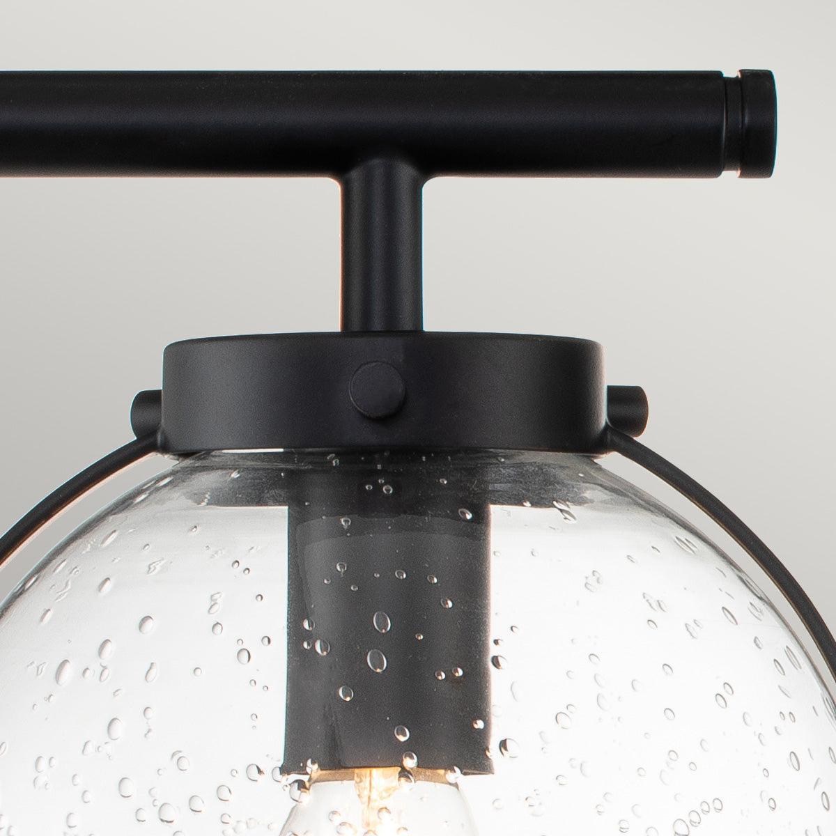 hinkley hollis 3 light black seeded glass bathroom wall light Close Up