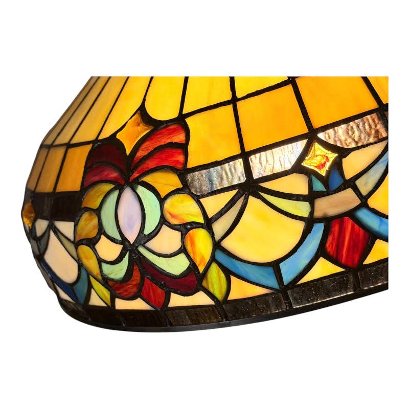 Stained glass lamp with colorful floral design on a white background