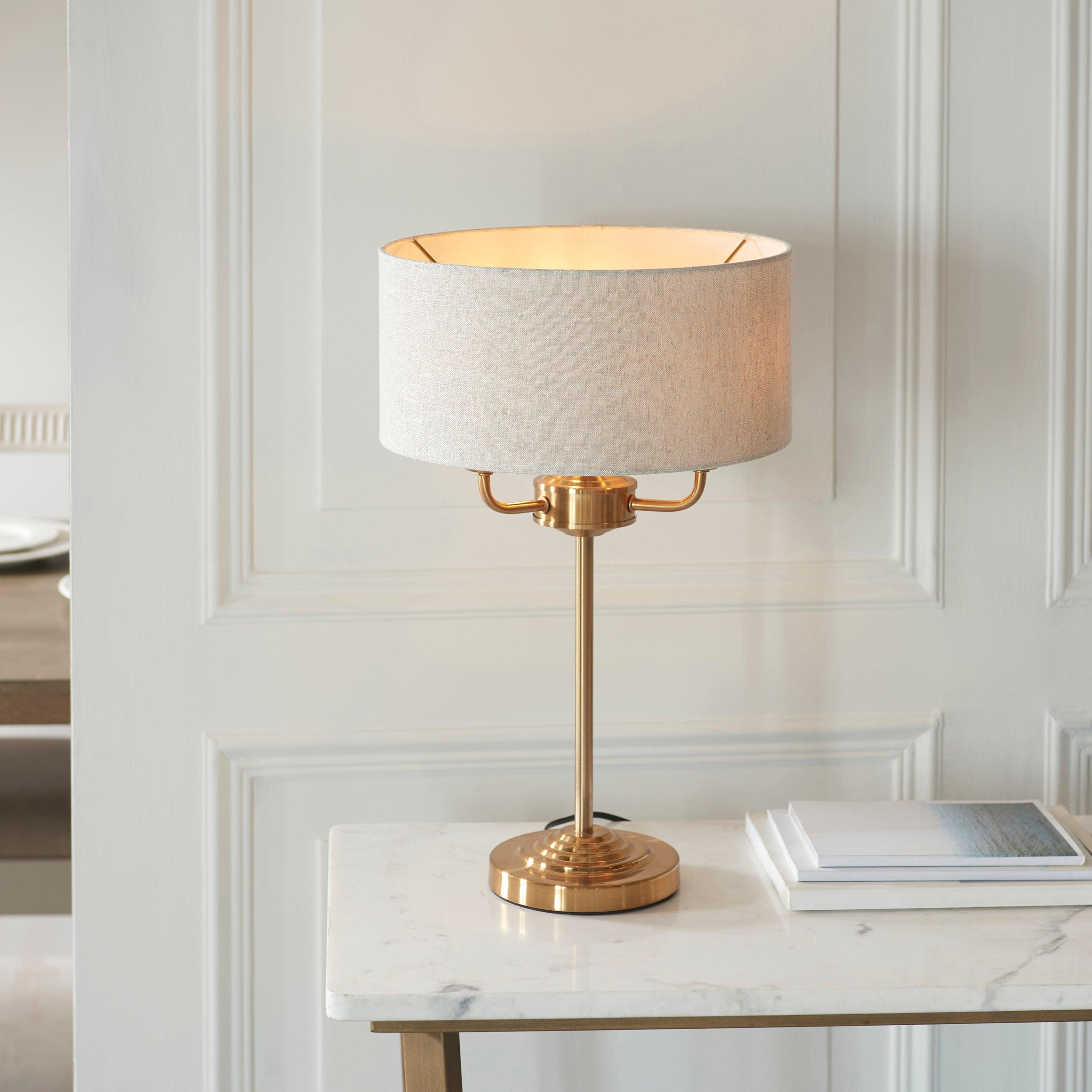 highclere vintage brass 3 light table lamp linen shade by Endon Lighting Living Room Family Shot