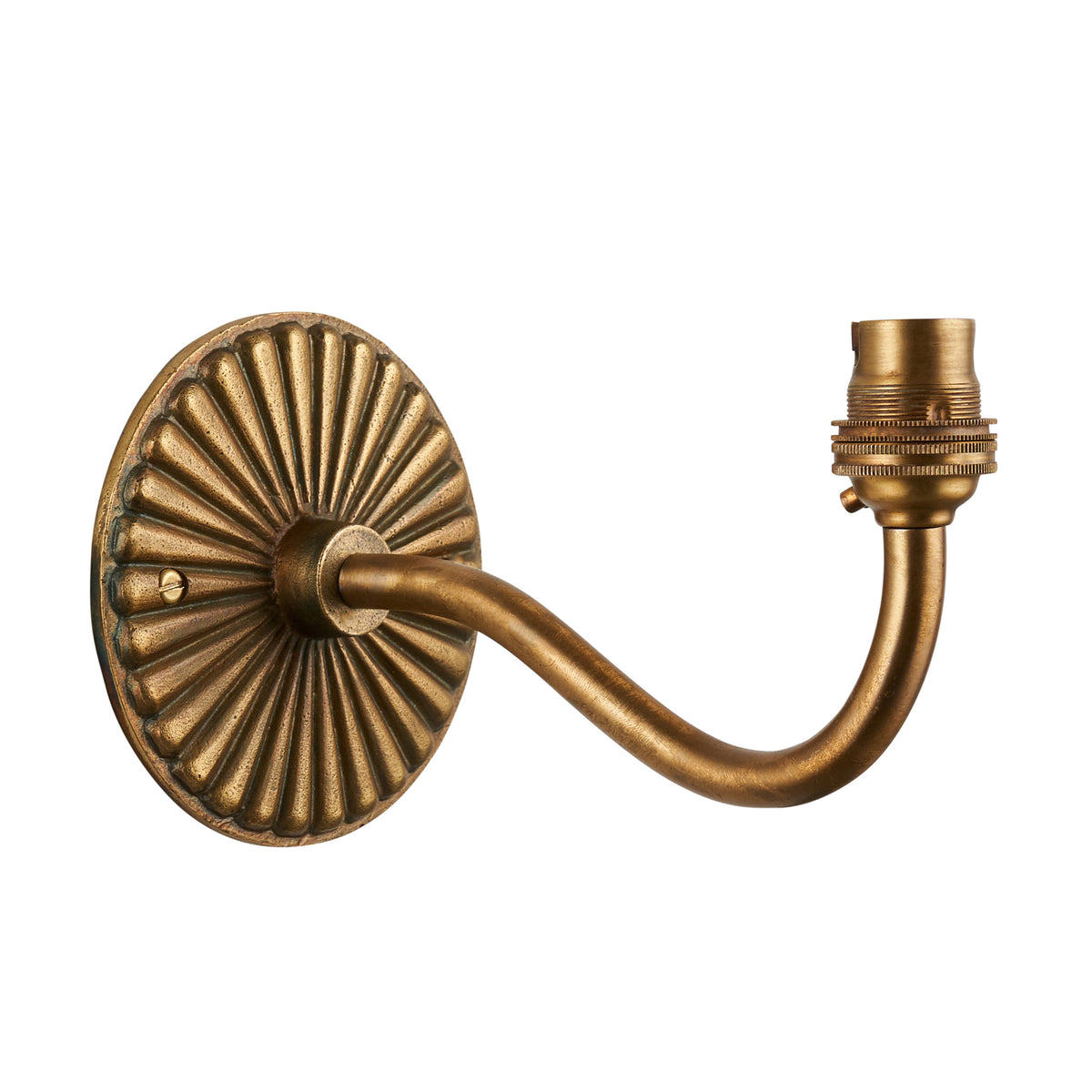 Dahlia Curve antique brass wall light with fluted round backplate and curved arm holding a brass bulb holder
