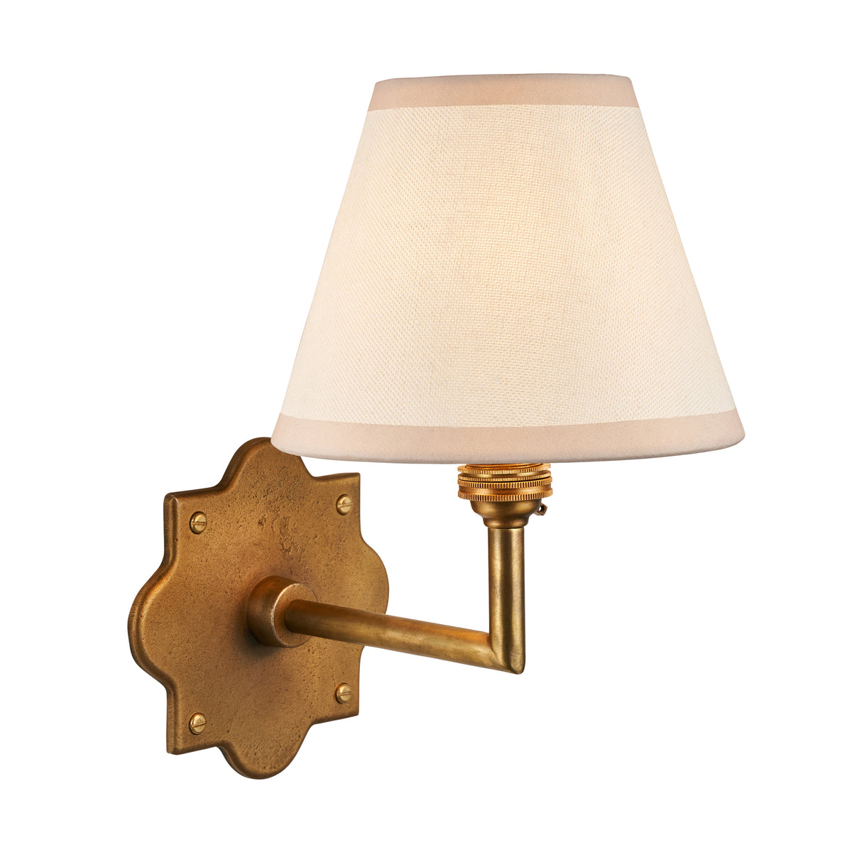 Anvil Angle brass wall light with plain ivory tapered fabric shade, studio shot on white