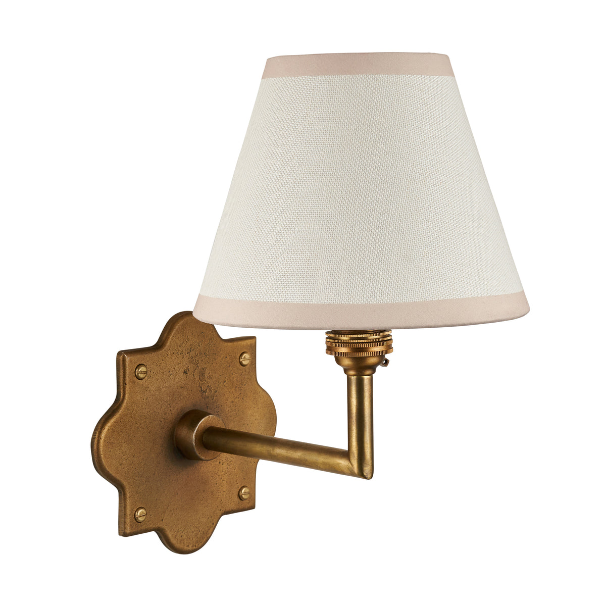 Anvil Angle brass wall light with ivory tapered shade and blush-trimmed edges on white