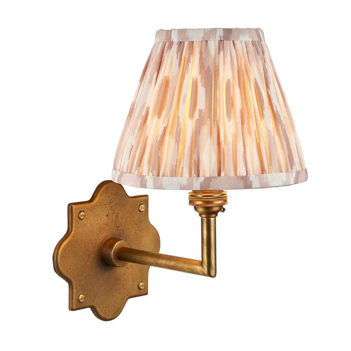 Anvil Angle antique brass wall light with pleated natural ikat shade on a white background