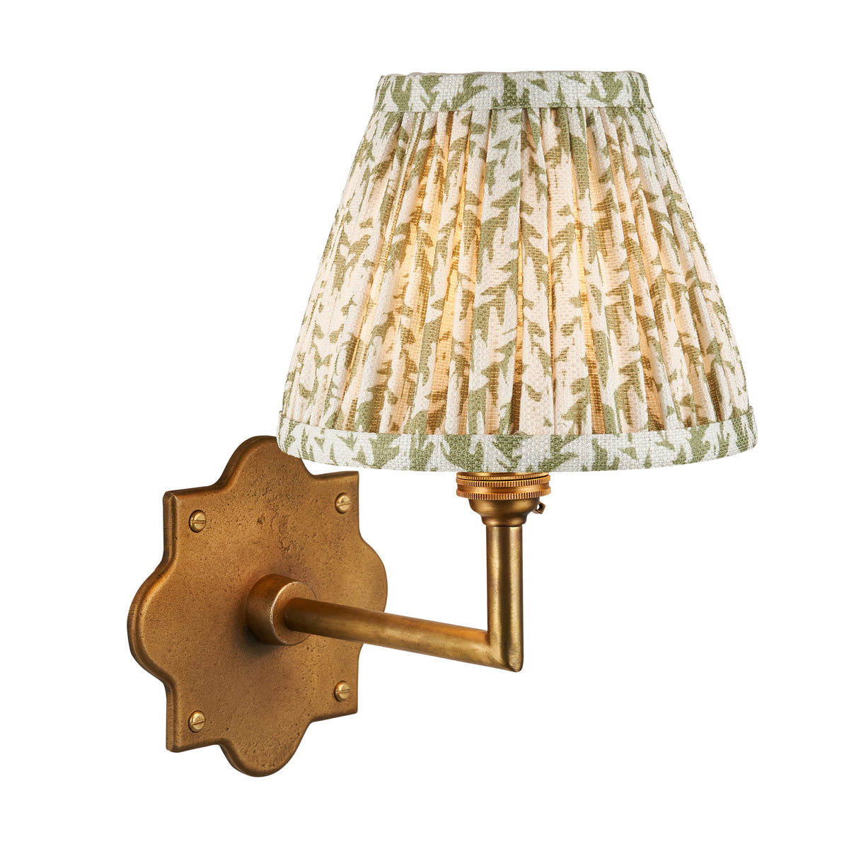 Anvil Angle & Leaf antique brass wall light with green leaf-print pleated shade on white