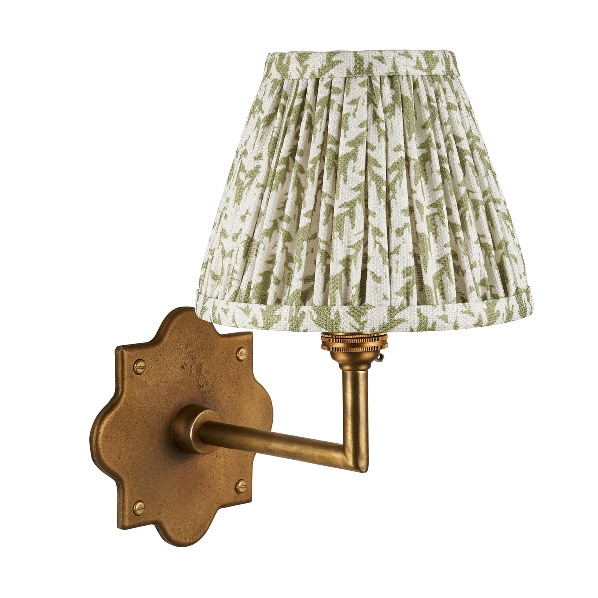 Anvil Angle & Leaf antique brass wall light with leafy green pleated shade on a white backdrop