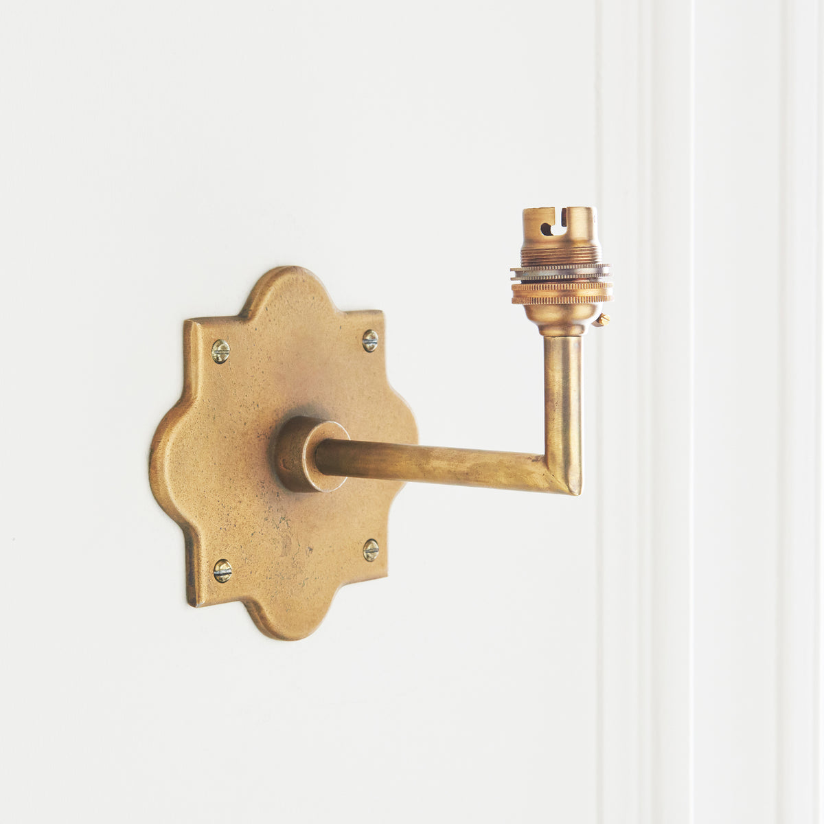 Anvil Angle brass bracket shown without a shade, quatrefoil plate, straight arm and lampholder