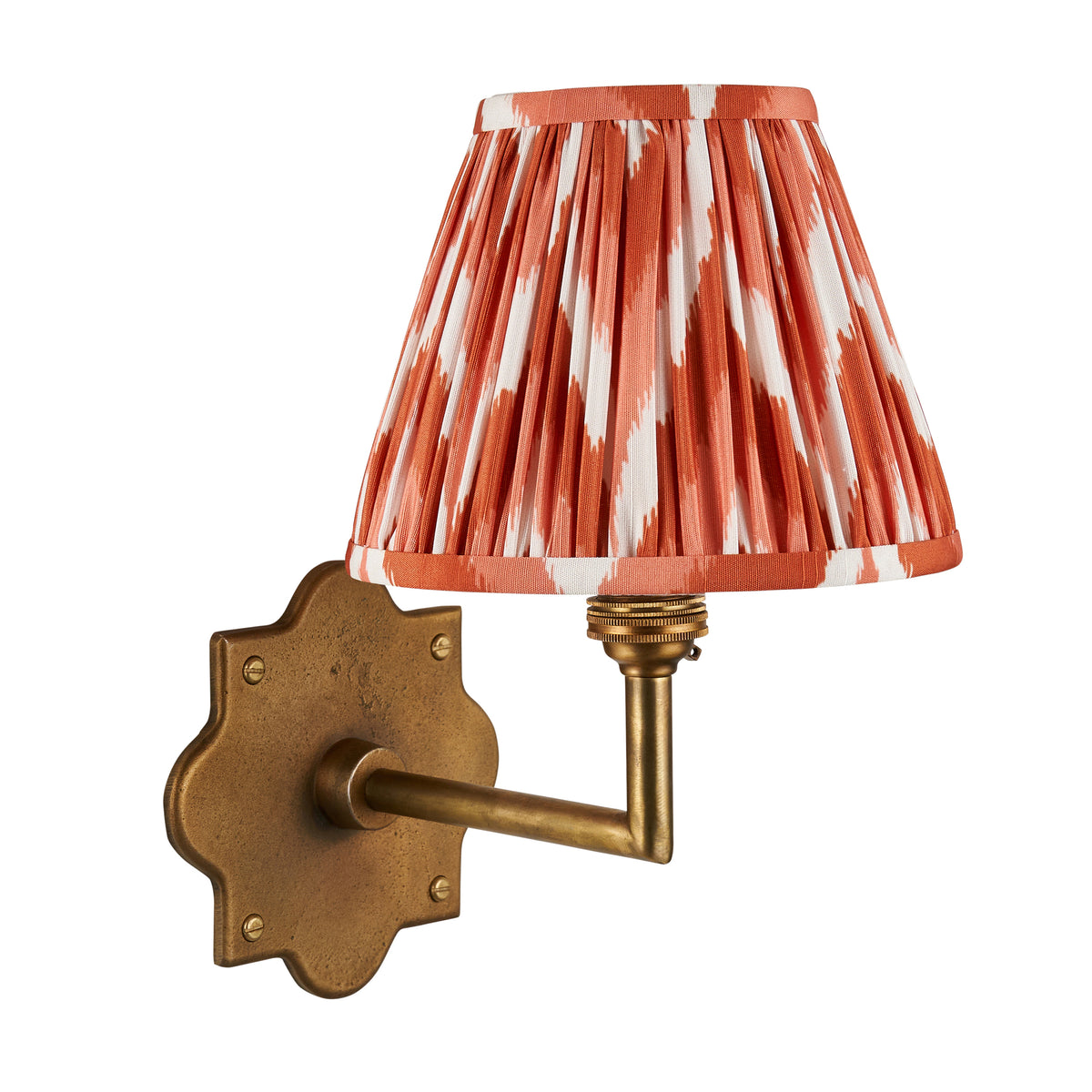 Anvil Angle antique brass wall light with orange zigzag ikat pleated shade, studio product shot