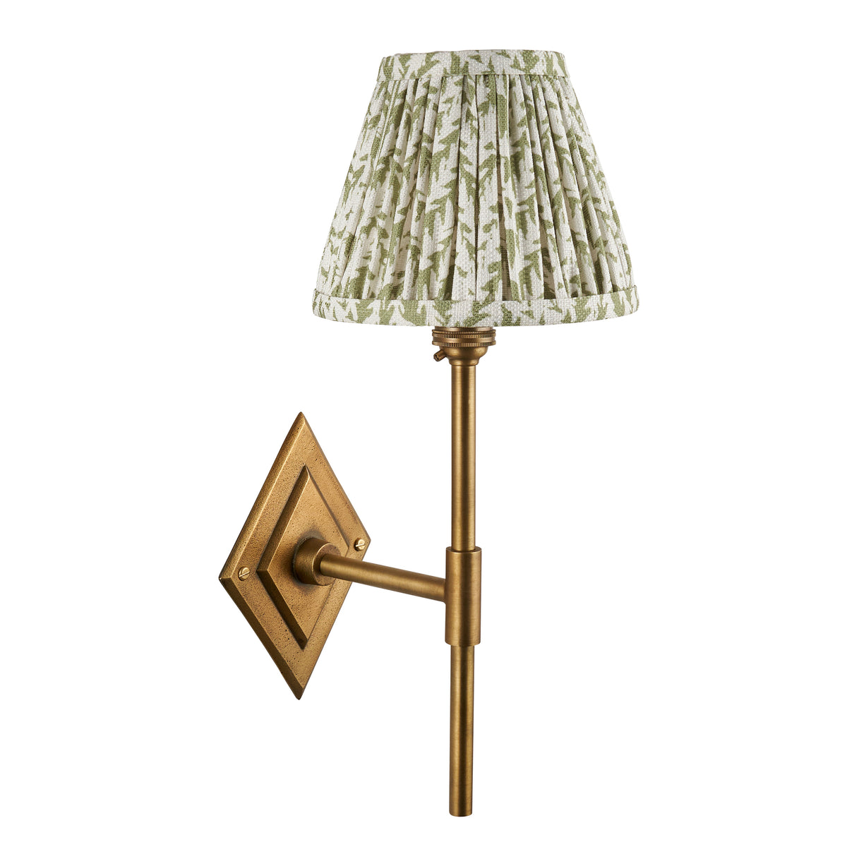 Diamond Tall antique brass wall light with green leaf-print pleated shade, cut out on white