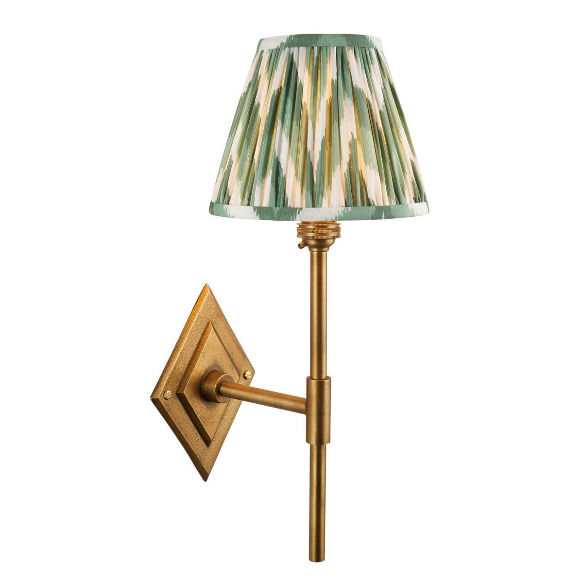 Diamond Tall antique brass wall light with green zigzag ikat pleated shade on a diamond backplate