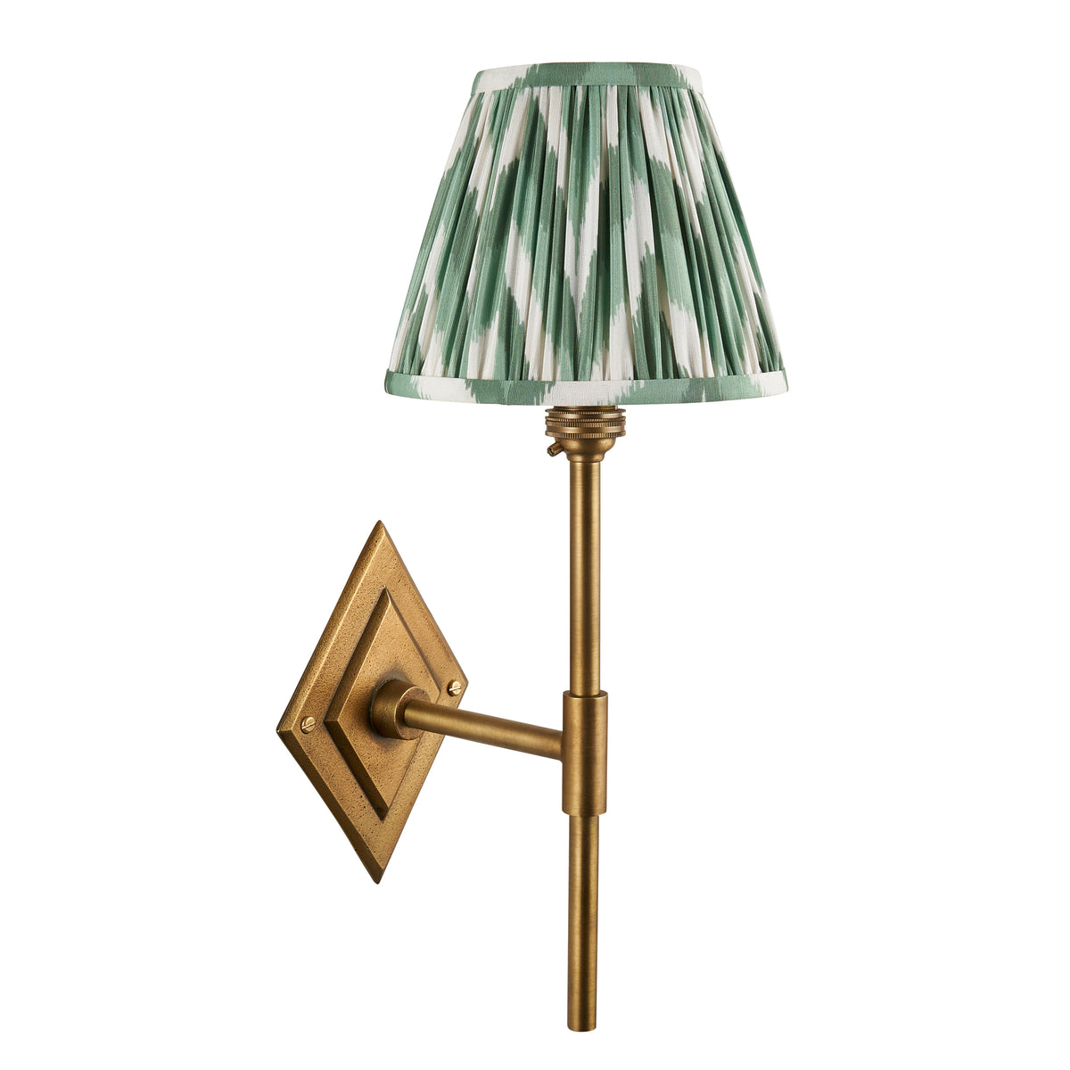 Diamond Tall antique brass wall light with green zigzag ikat shade, cut out on white