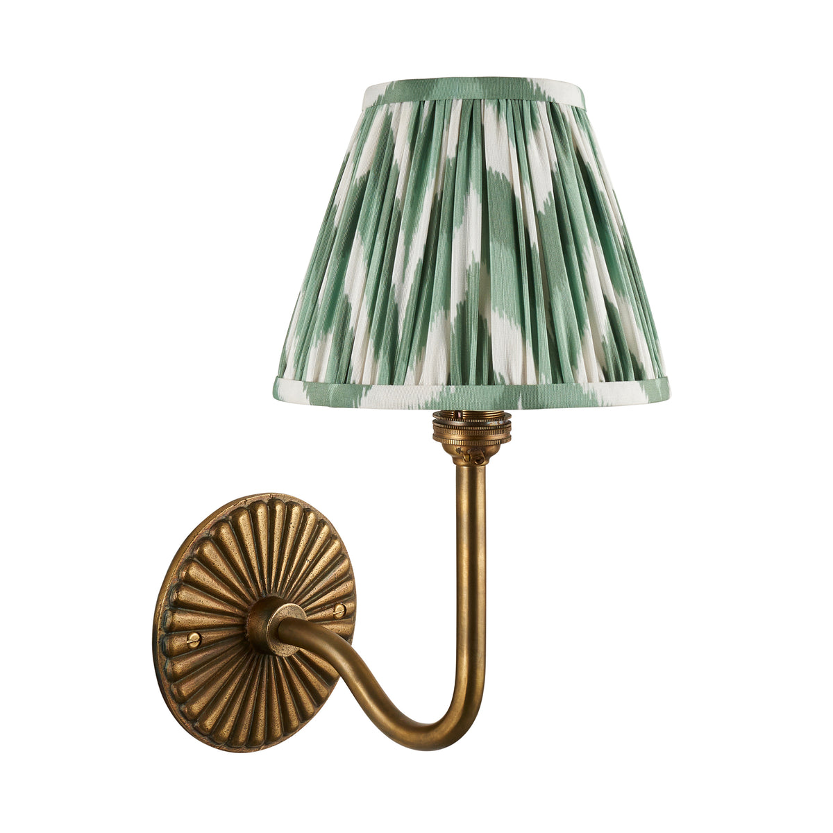 Dahlia Swan antique brass wall light with green ikat pleated shade, studio shot on white