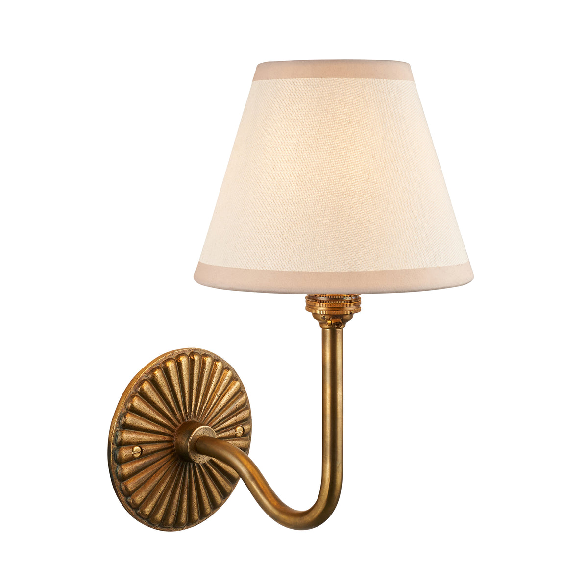 Dahlia Swan antique brass wall light with plain cream linen tapered shade on white background