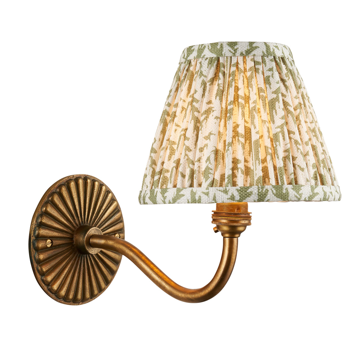 Dahlia Curve antique brass wall light with curved arm and green leaf-print pleated shade